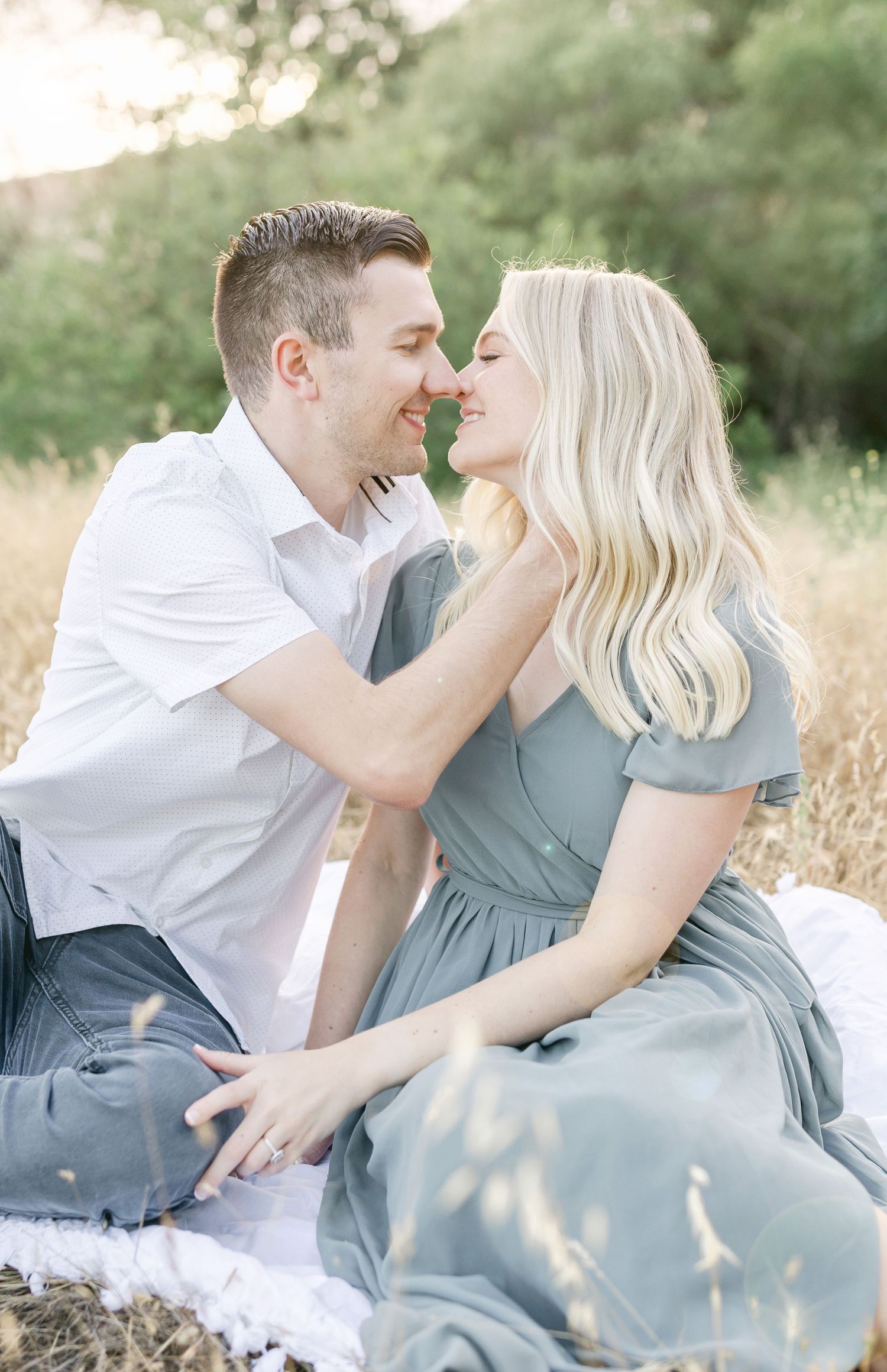 Kissing on the blanket Captured by Chelsee Rawe Photography