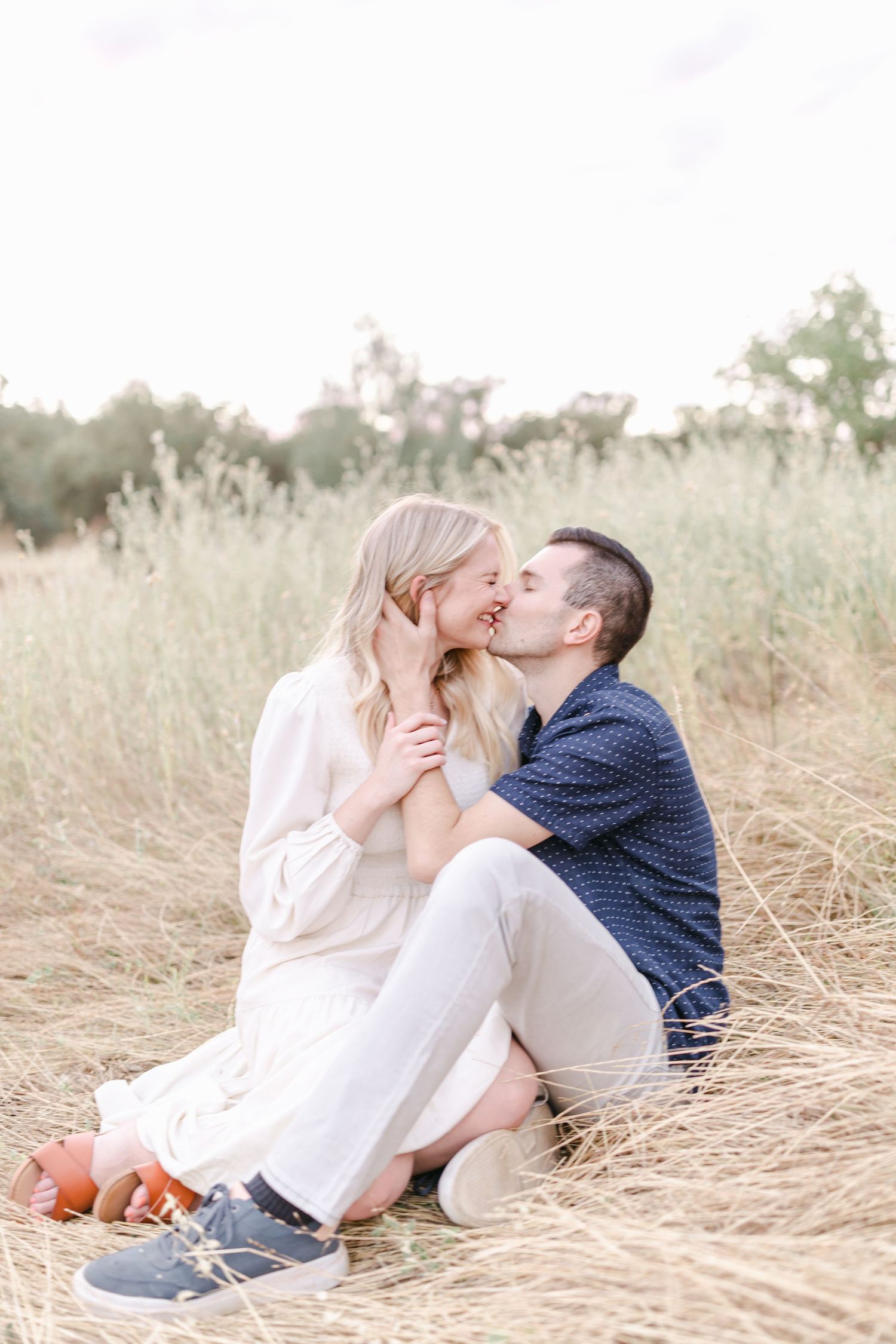 Kissing passionately in the golden weeds