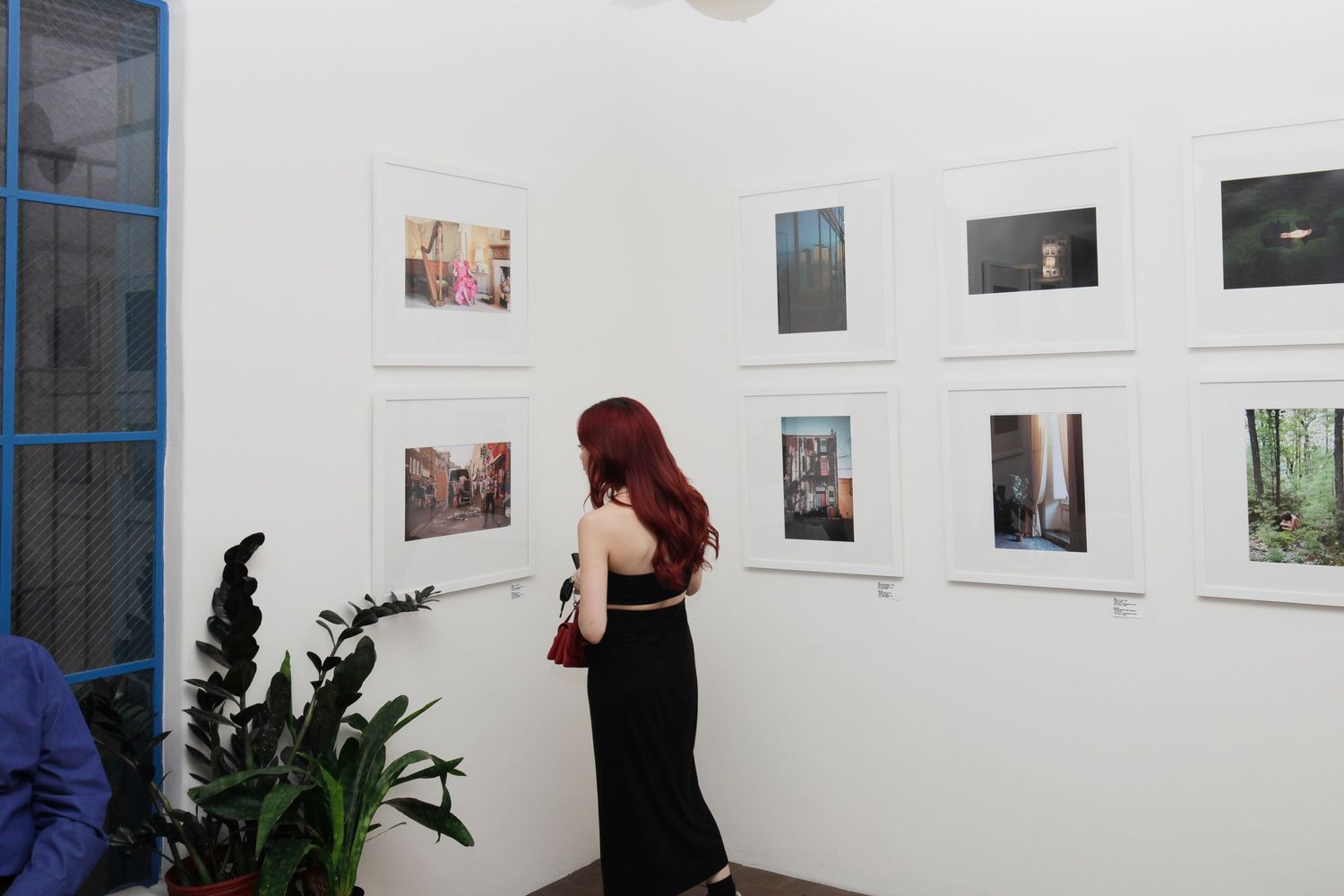 Lady looks at photo in Decode gallery in Arizona