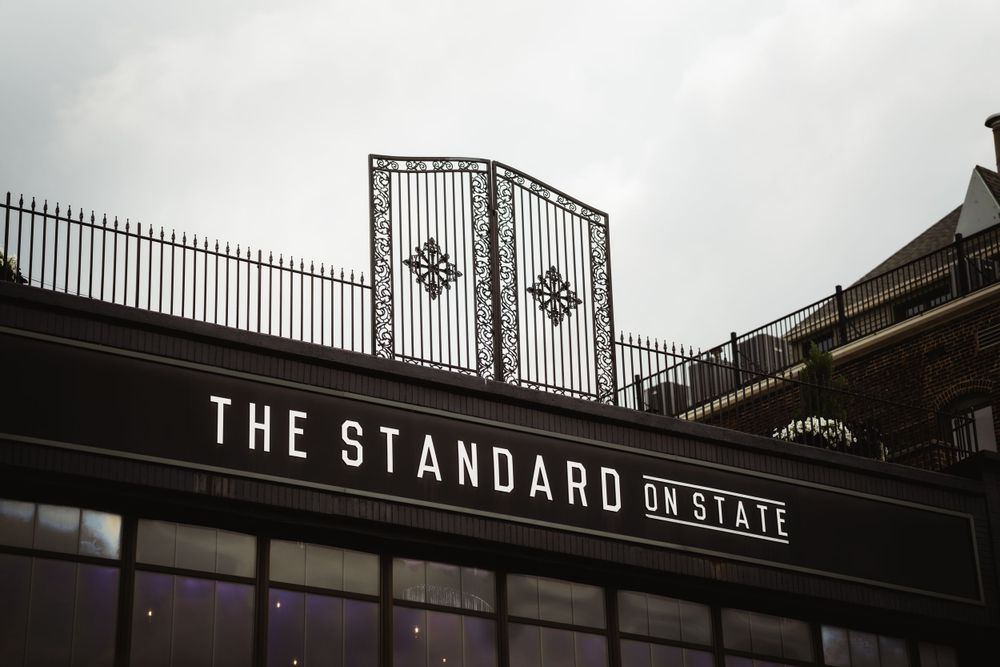 Black and white architectural detail of 'The Standard' venue's ornate iron gates.