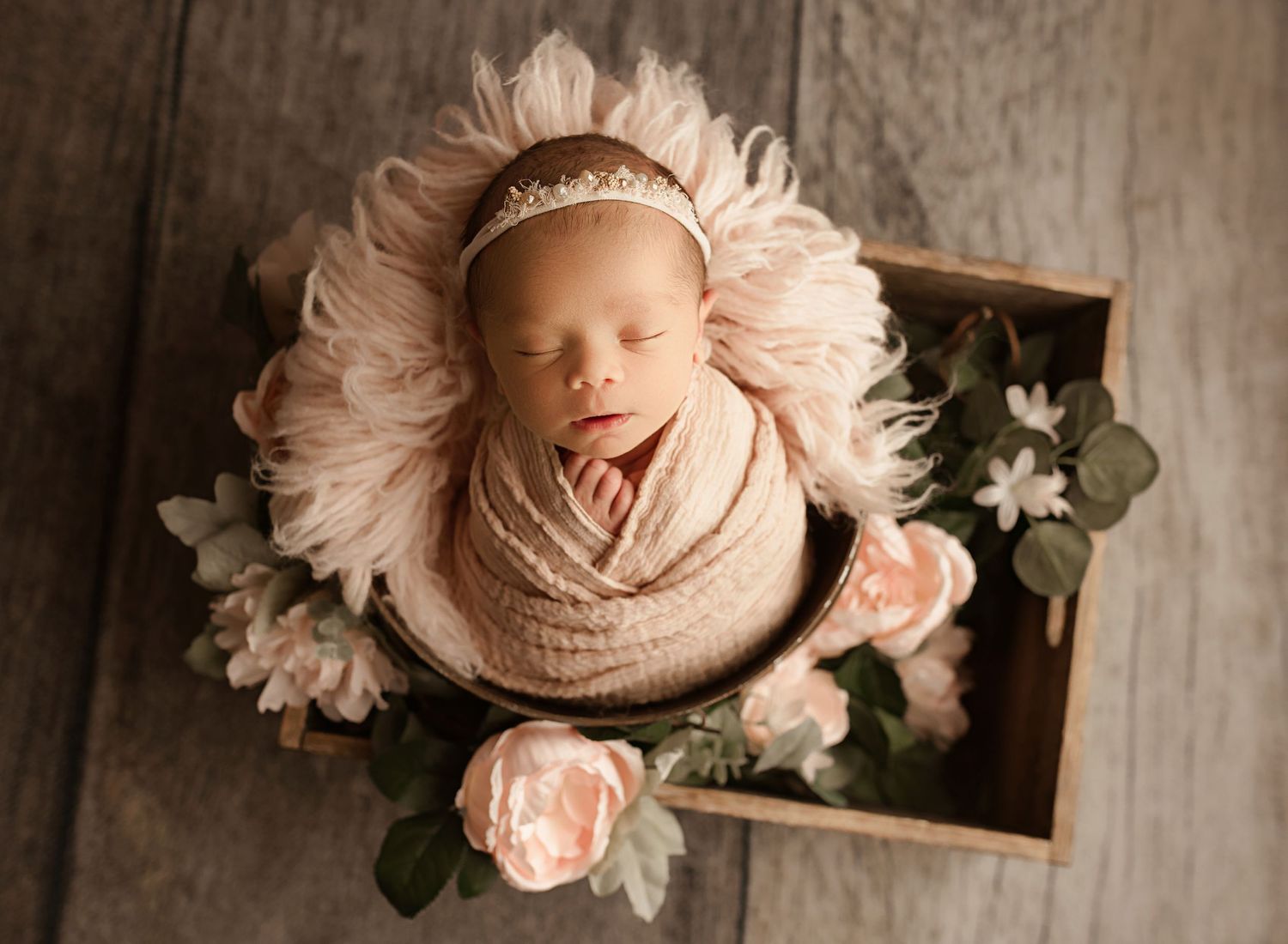Riverside newborn photography, newborn girl sleeping in wooden box with pink roses