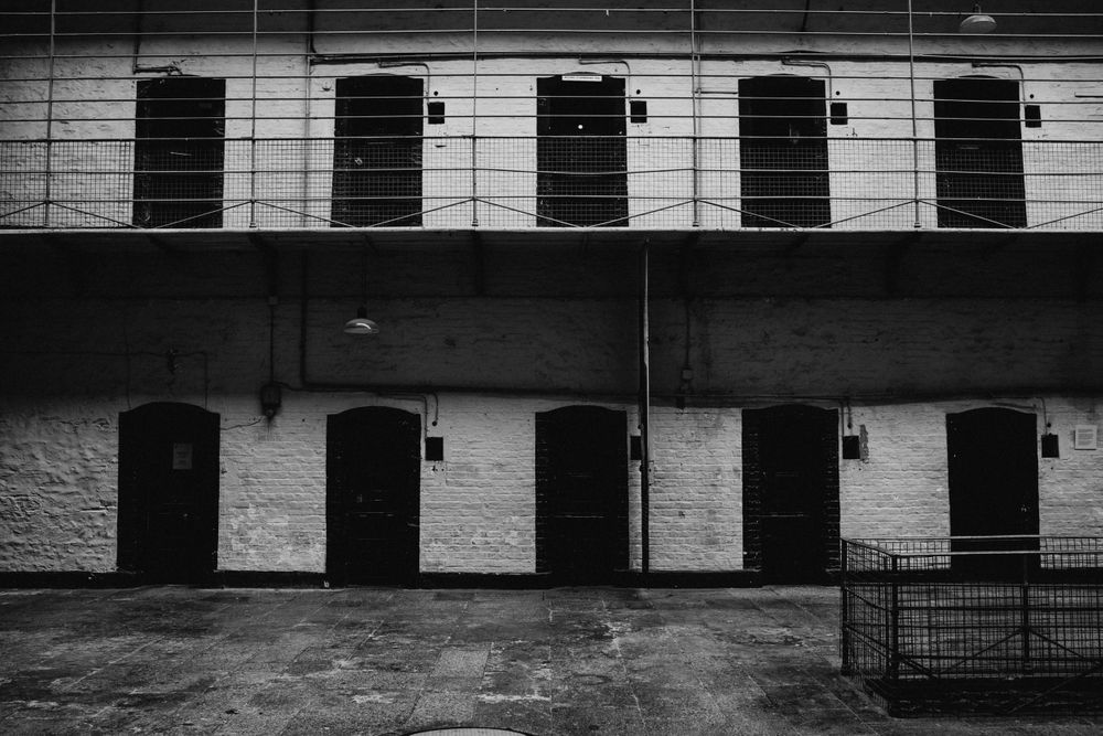 Minimalist architectural detail of repeating brick patterns and doorways.