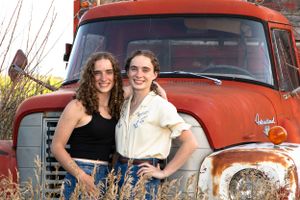 becky katzberg photography senior girl twin photos at the farm with red truck