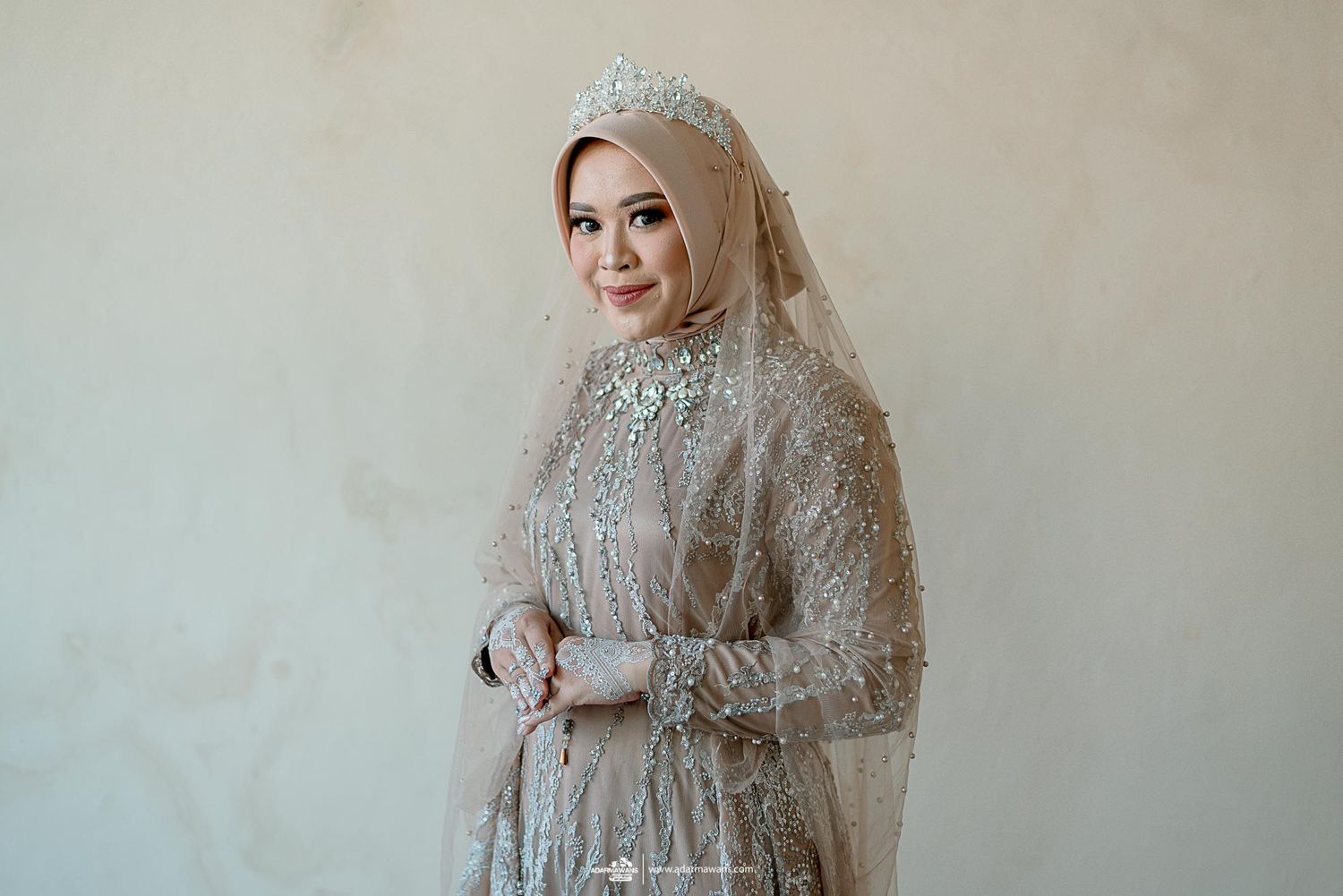 Elegant grey beaded wedding dress with intricate embroidery and matching hijab.