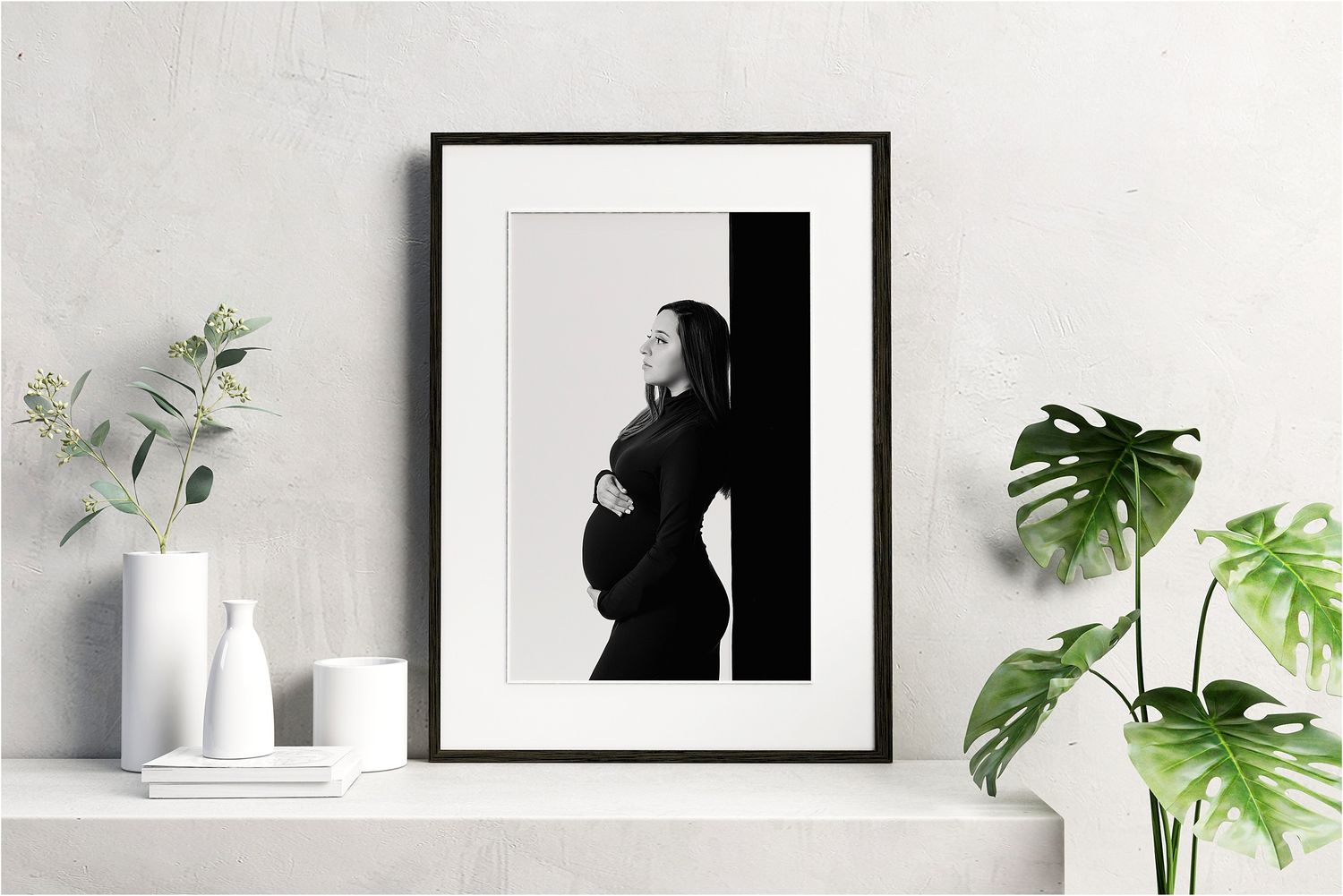Framed maternity wall art display in Austin photography studio home decor setting