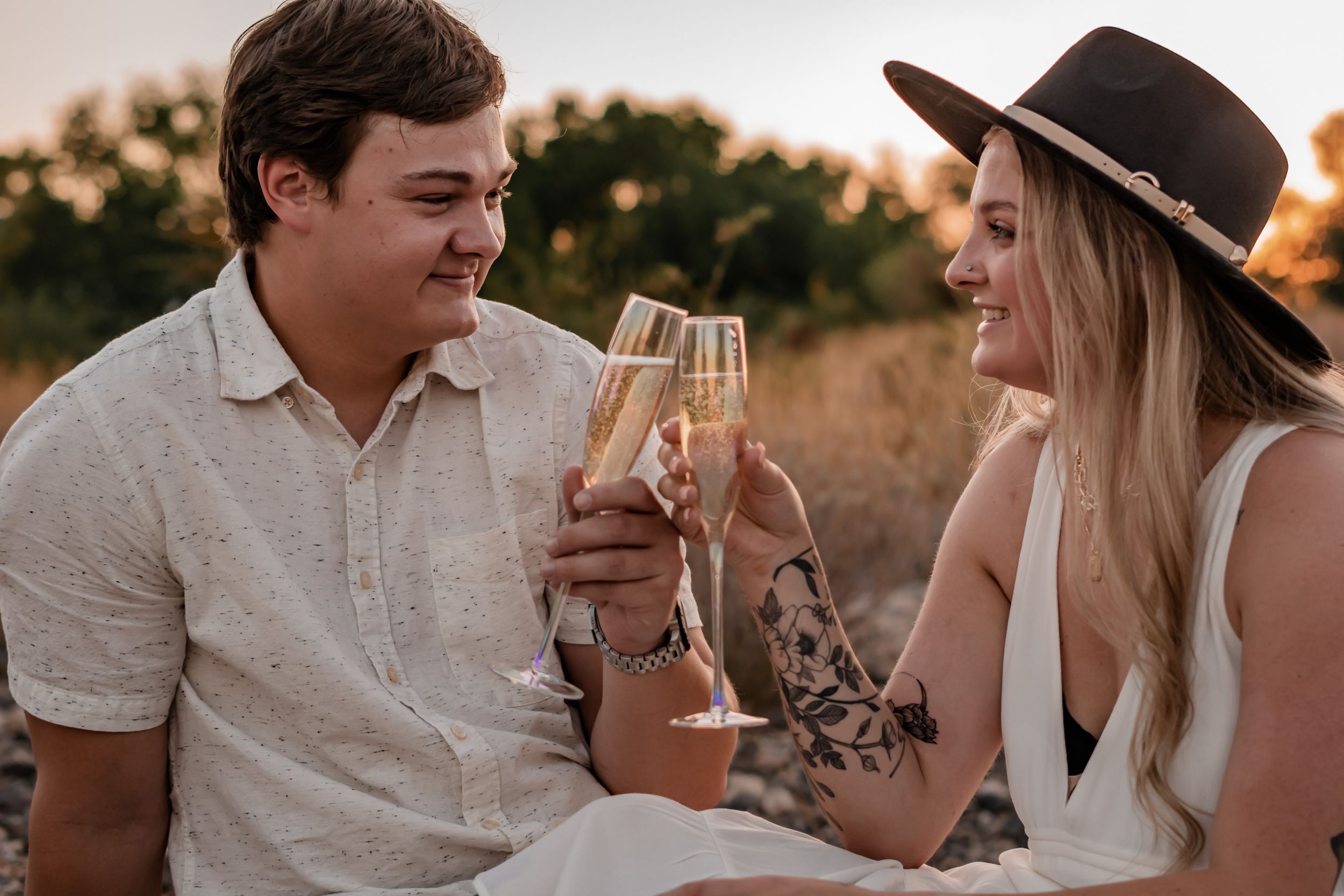 engaged couple celebrating with champagne