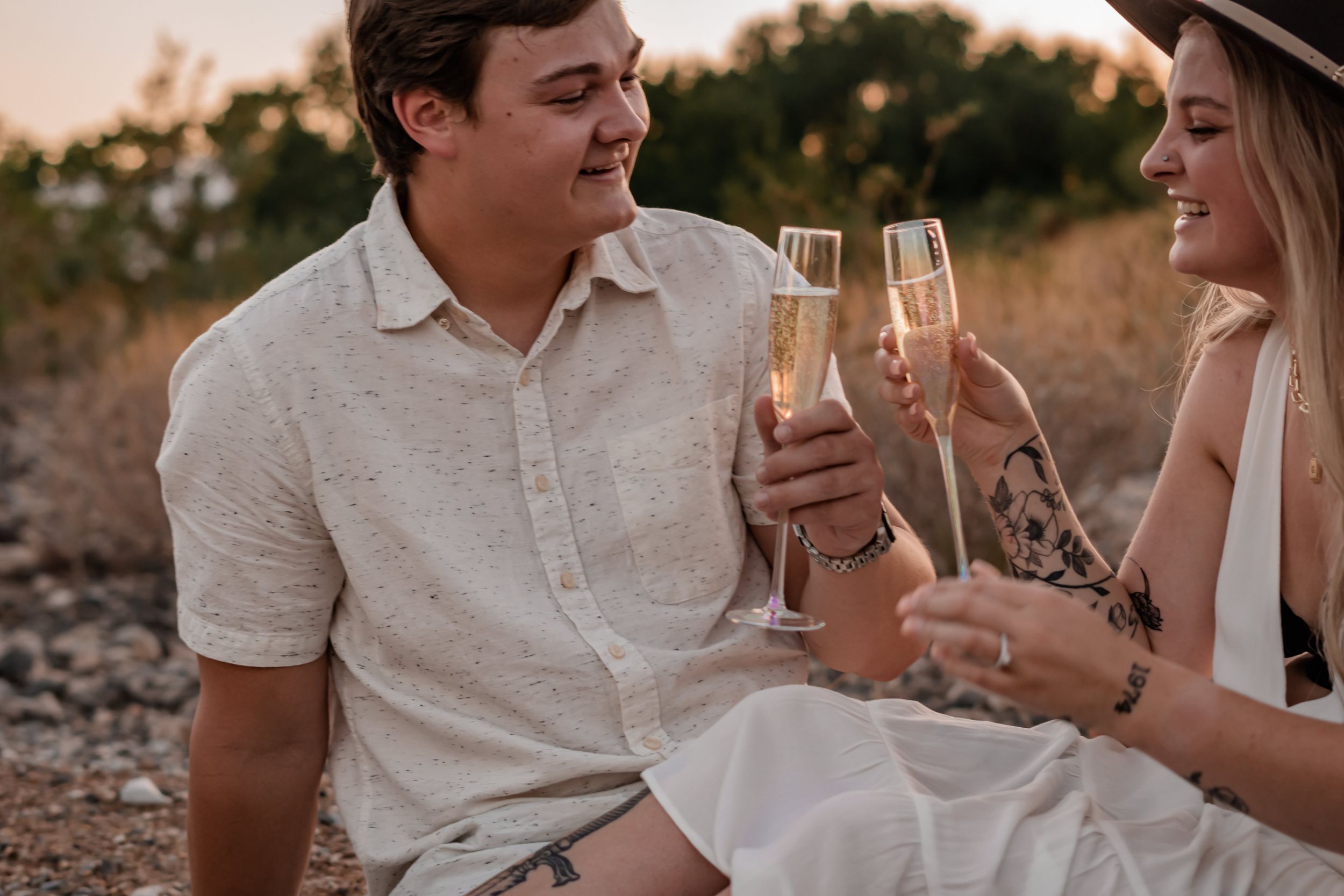 engaged couple celebrating with champagne