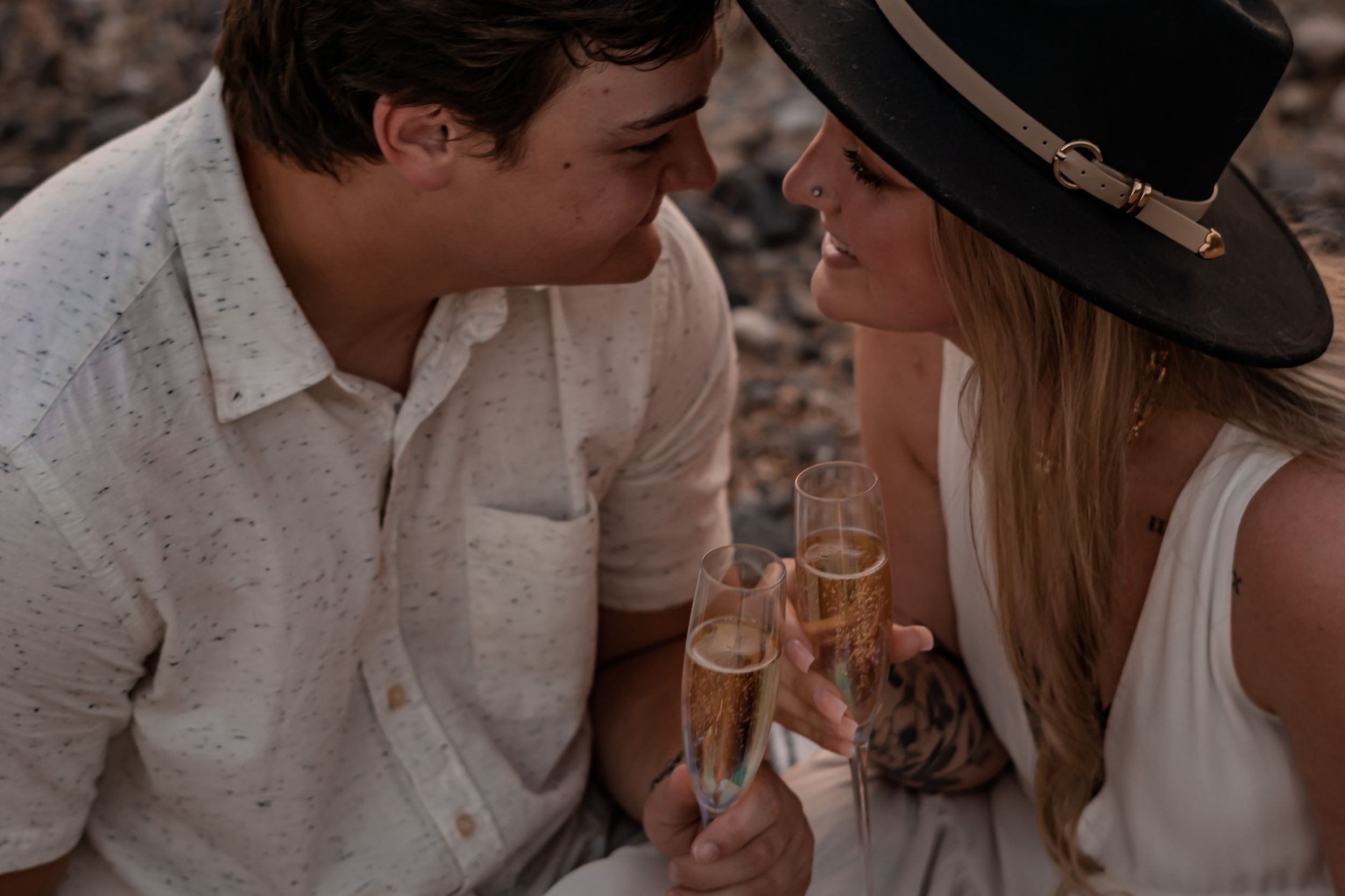engaged couple celebrating with champagne