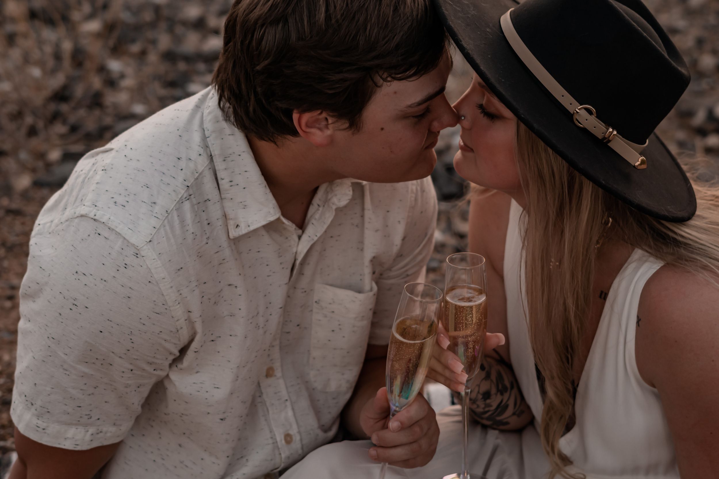 engaged couple celebrating with champagne