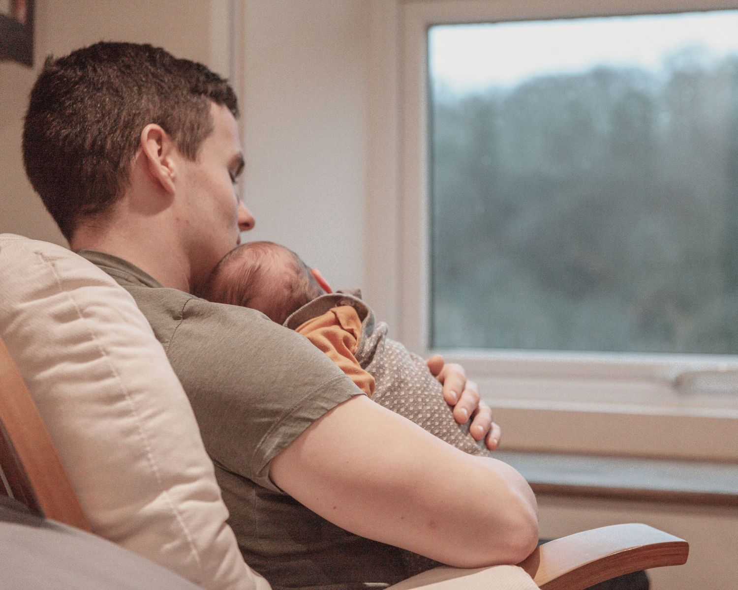 New born at home photo shoot with Cornwall new born photographer dad and baby