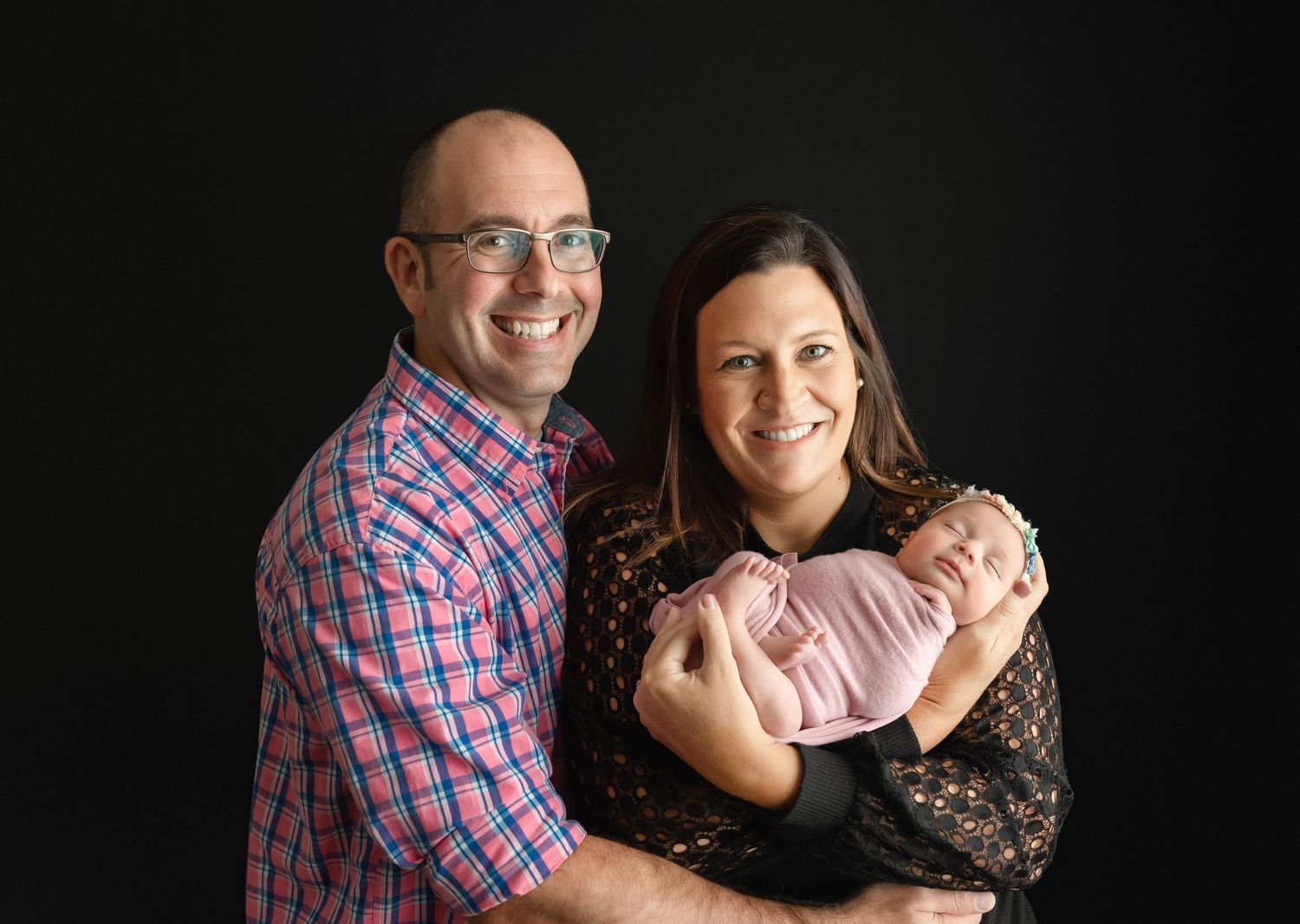 Mom and Dad are holding their newborn girl. Greenville SC newborn photographer, Easley, SC newborn photographer, Upstate SC newborn
