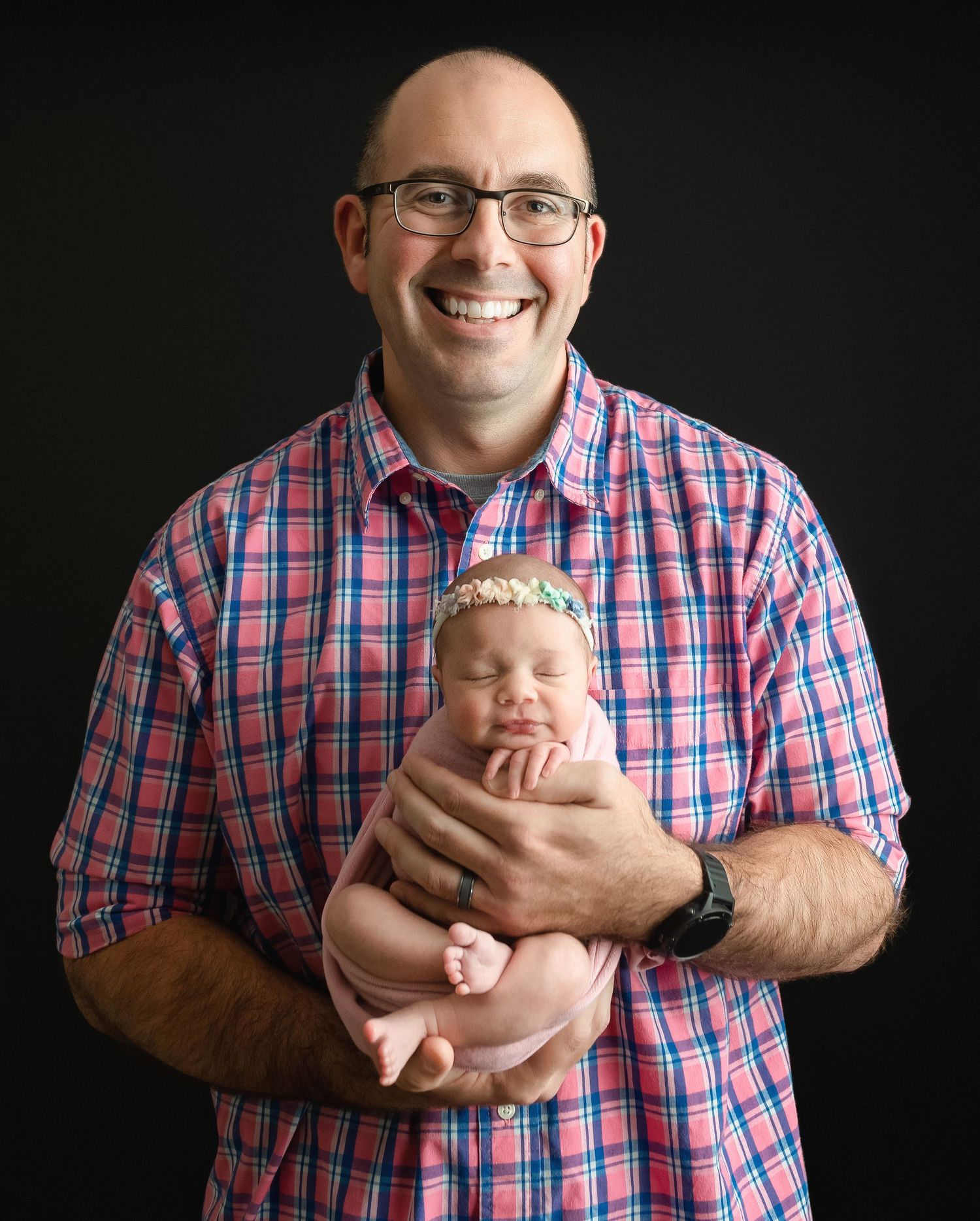 Dad is holding his newborn girl. Greenville SC newborn photographer, Easley, SC newborn photographer, Upstate SC newborn