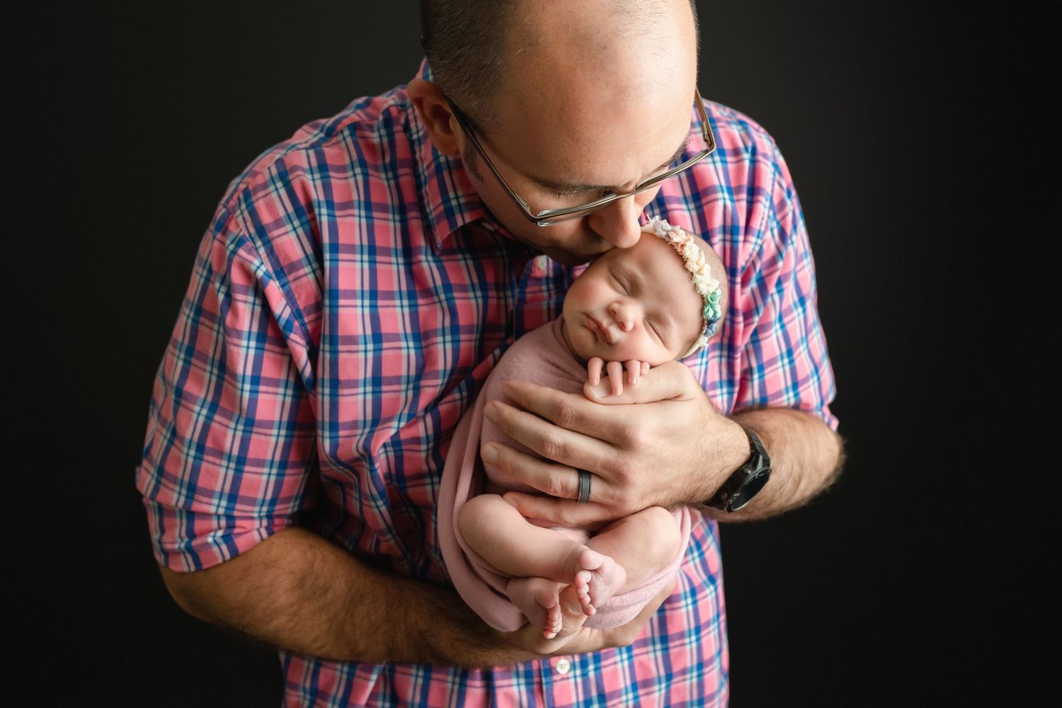 Dad is kissing his newborn girl. Greenville SC newborn photographer, Easley, SC newborn photographer, Upstate SC newborn