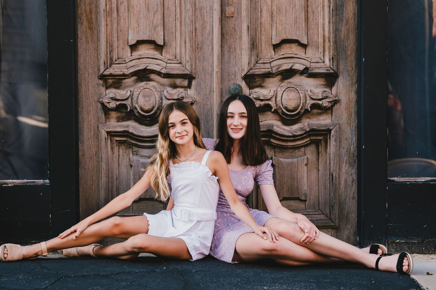sisters sitting by door