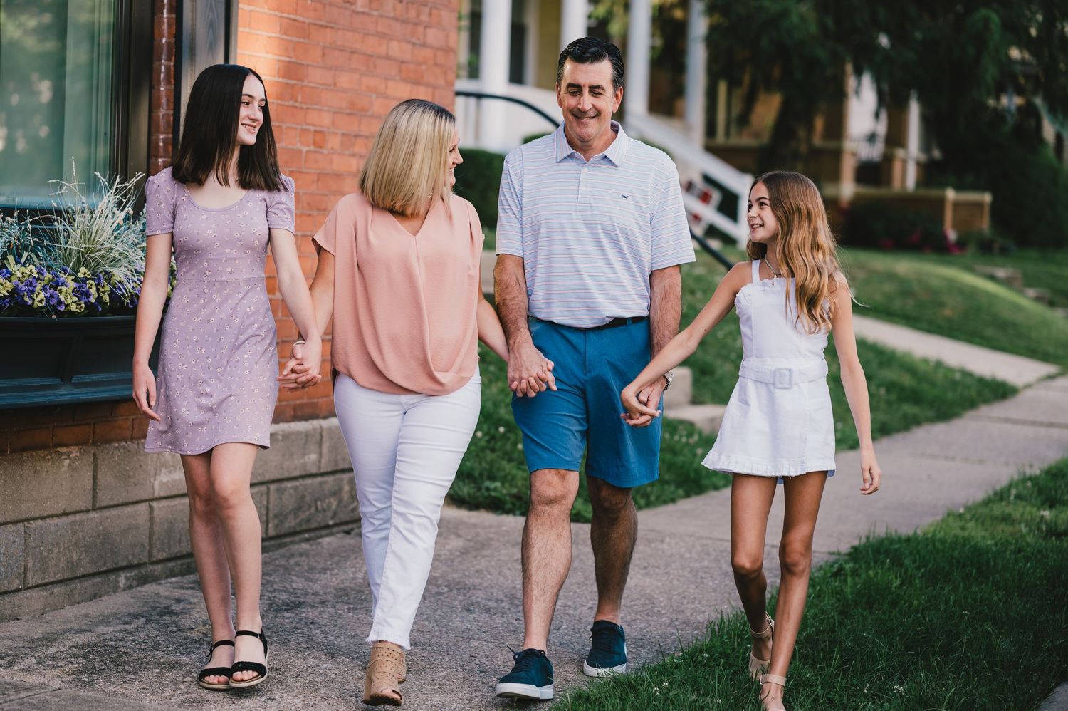 family walking down street