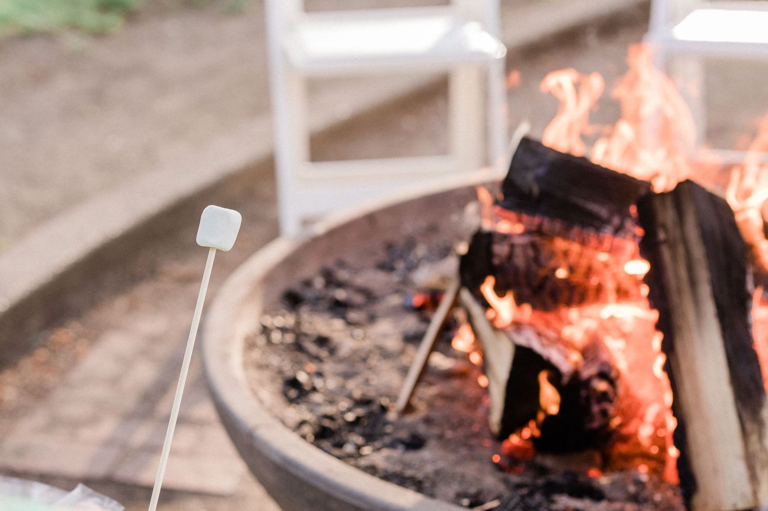roasting marshmallows over fire pit.