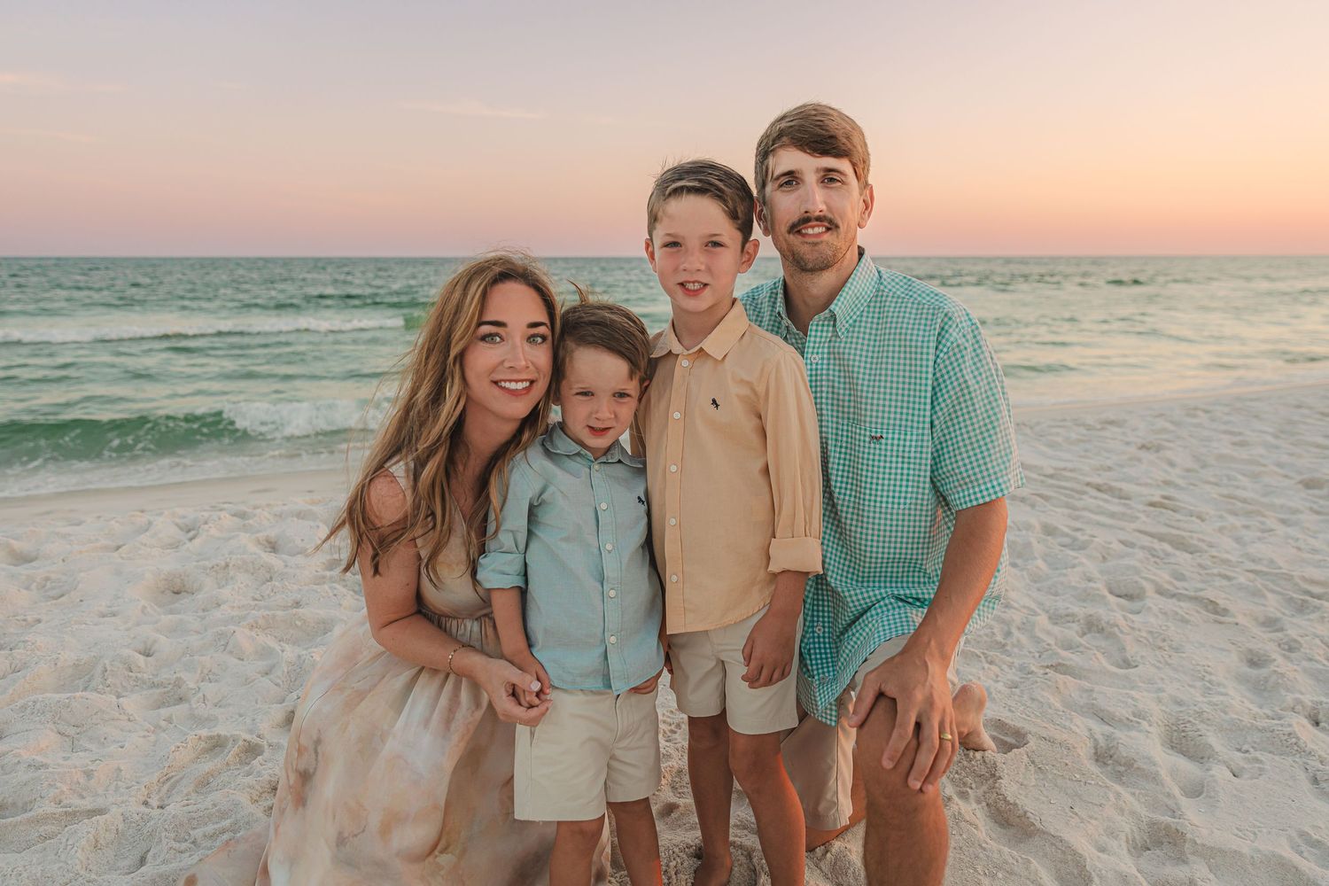 A series of beach sunset photos showing a group posing together in coordinated beige and turquoise outfits on white sand.