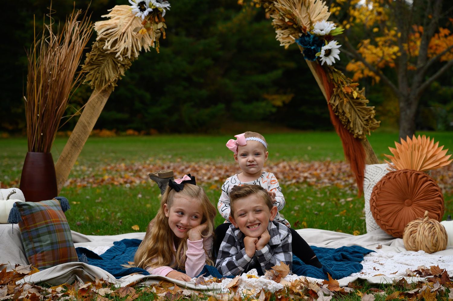 Three children posing for kids session in Orr, Minnesota.