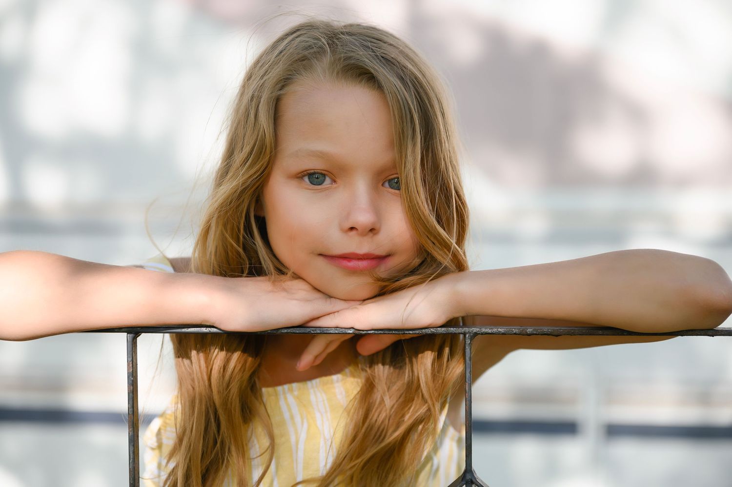 Girl posing for kids photo session on Pelican Lake in Orr, MN.