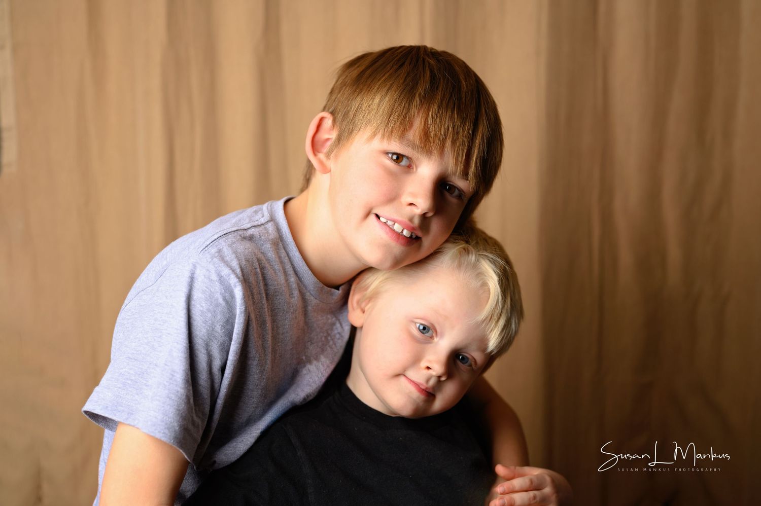 Two boys pose for photoshoot in Orr, Minnesota.