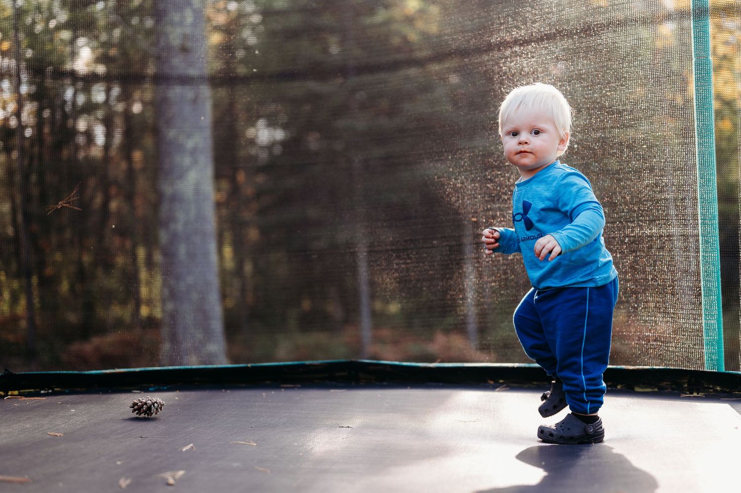 Young boy on trampoline for kids photoshoot in Balkan, Minnesota.