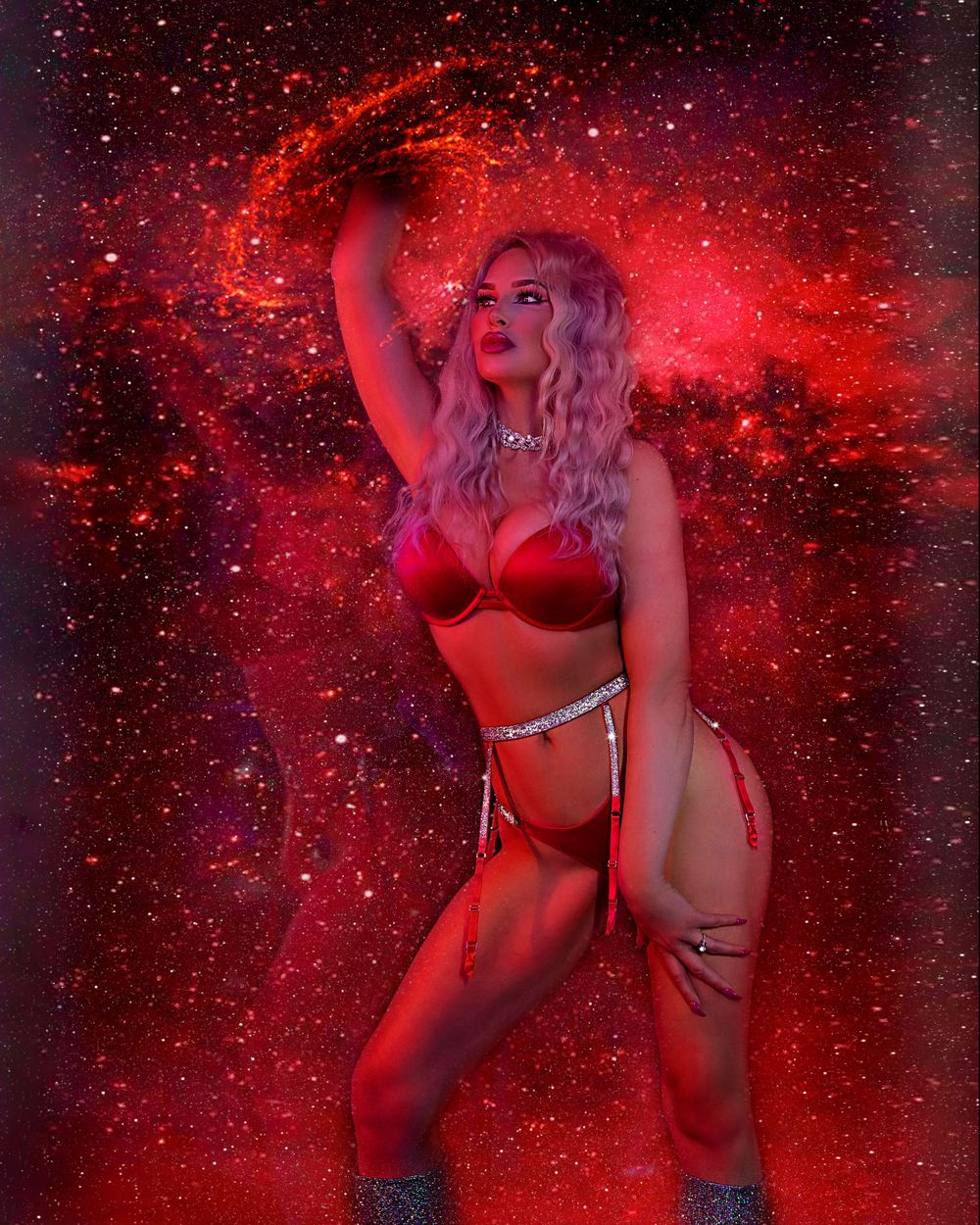 Artistic portrait with red lighting effects and glitter overlay against a starry background.