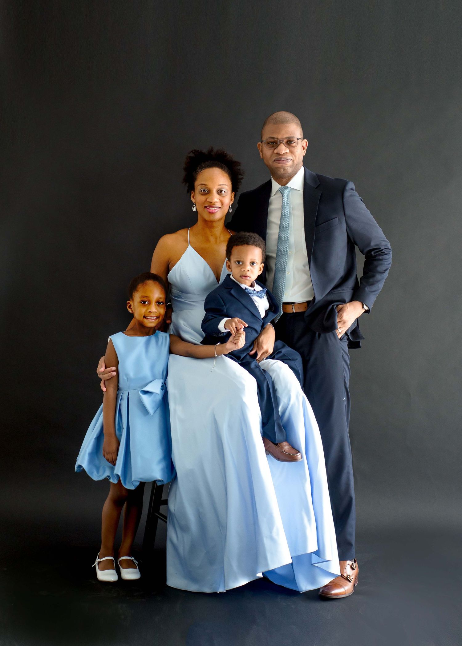 family taking pictures together in a natural light studio houston texas