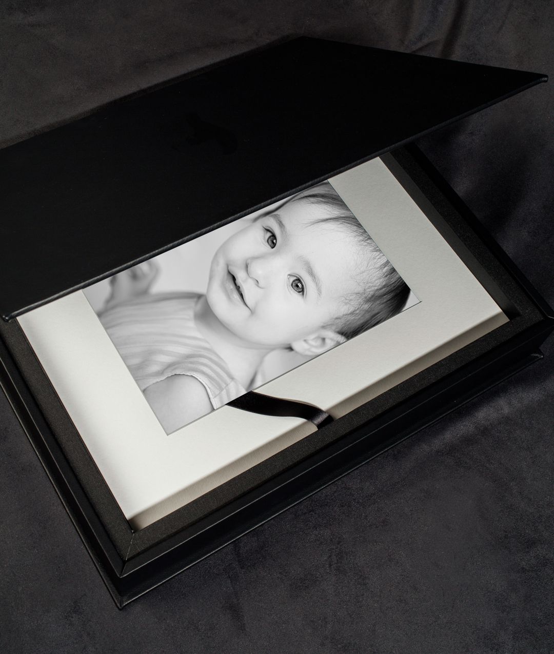 Folio box in which you may put 10 of your matted portraits.  Offer in different colours and material.