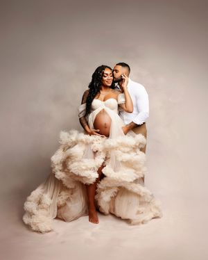 New Hampshire studio maternity photography of an expecting couple, intimate pregnancy portrait with cream tulle gown and soft, timeless