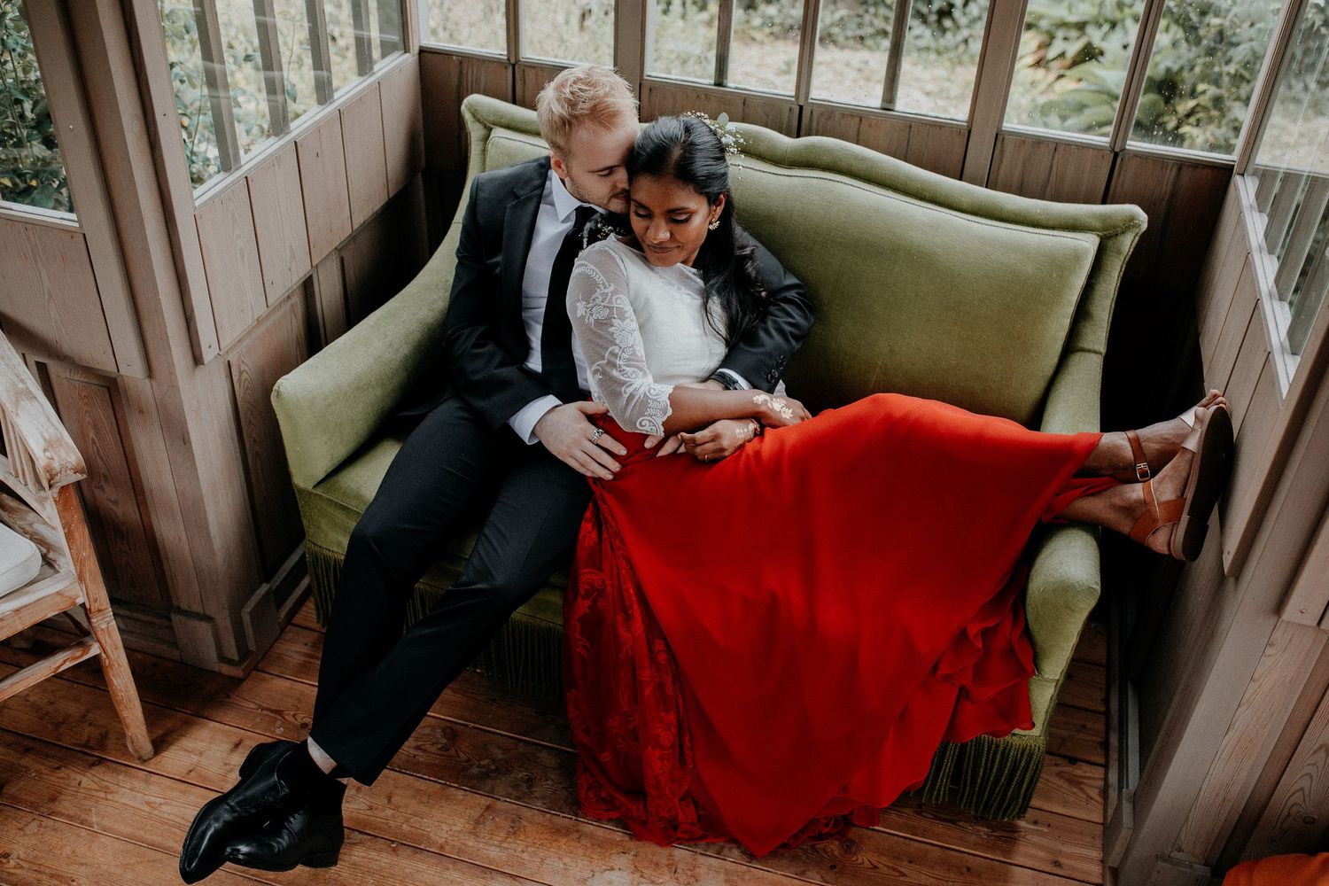 A joyful wedding ceremony moment as couple exchanges rings outdoors.