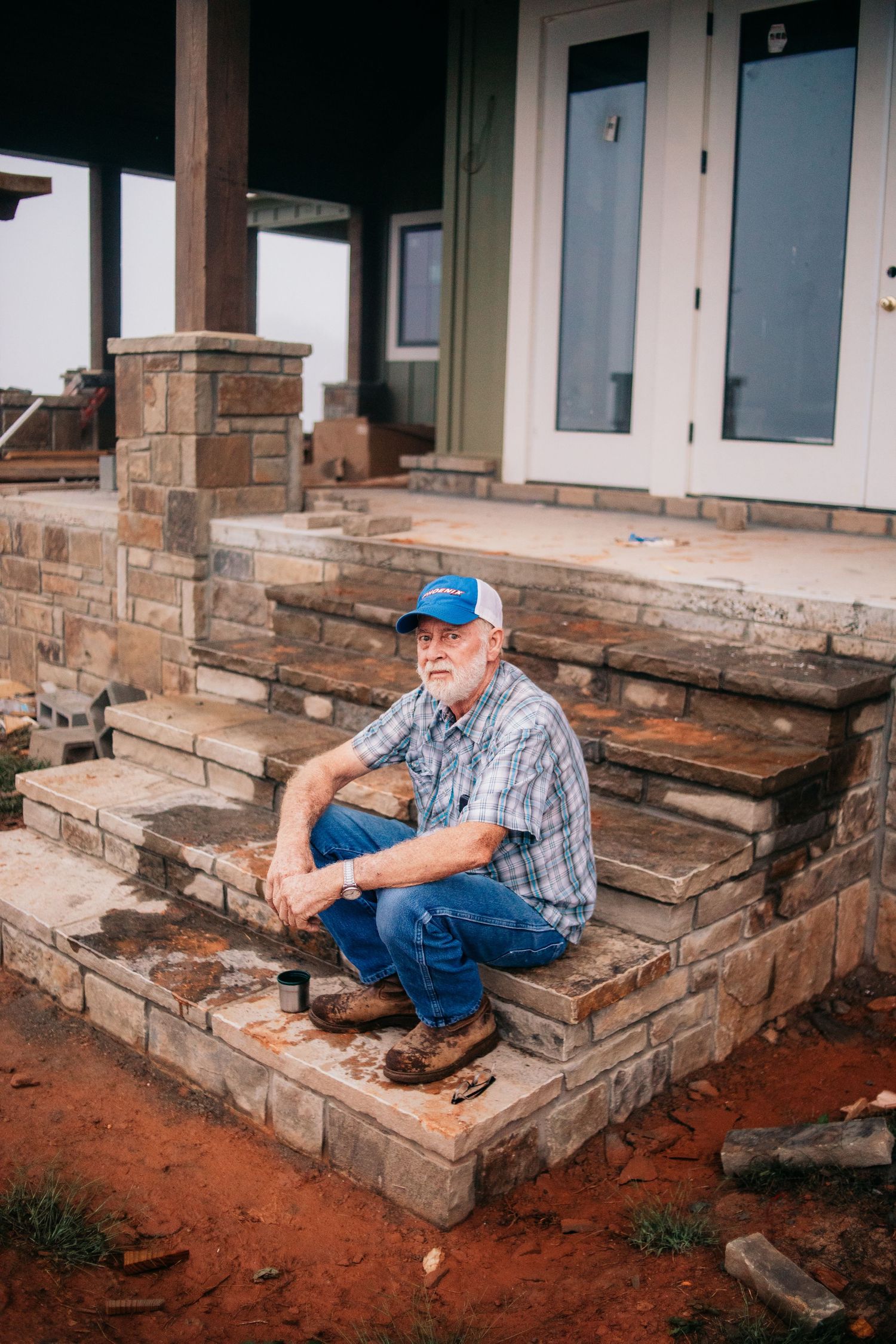 older man sitting on stairs