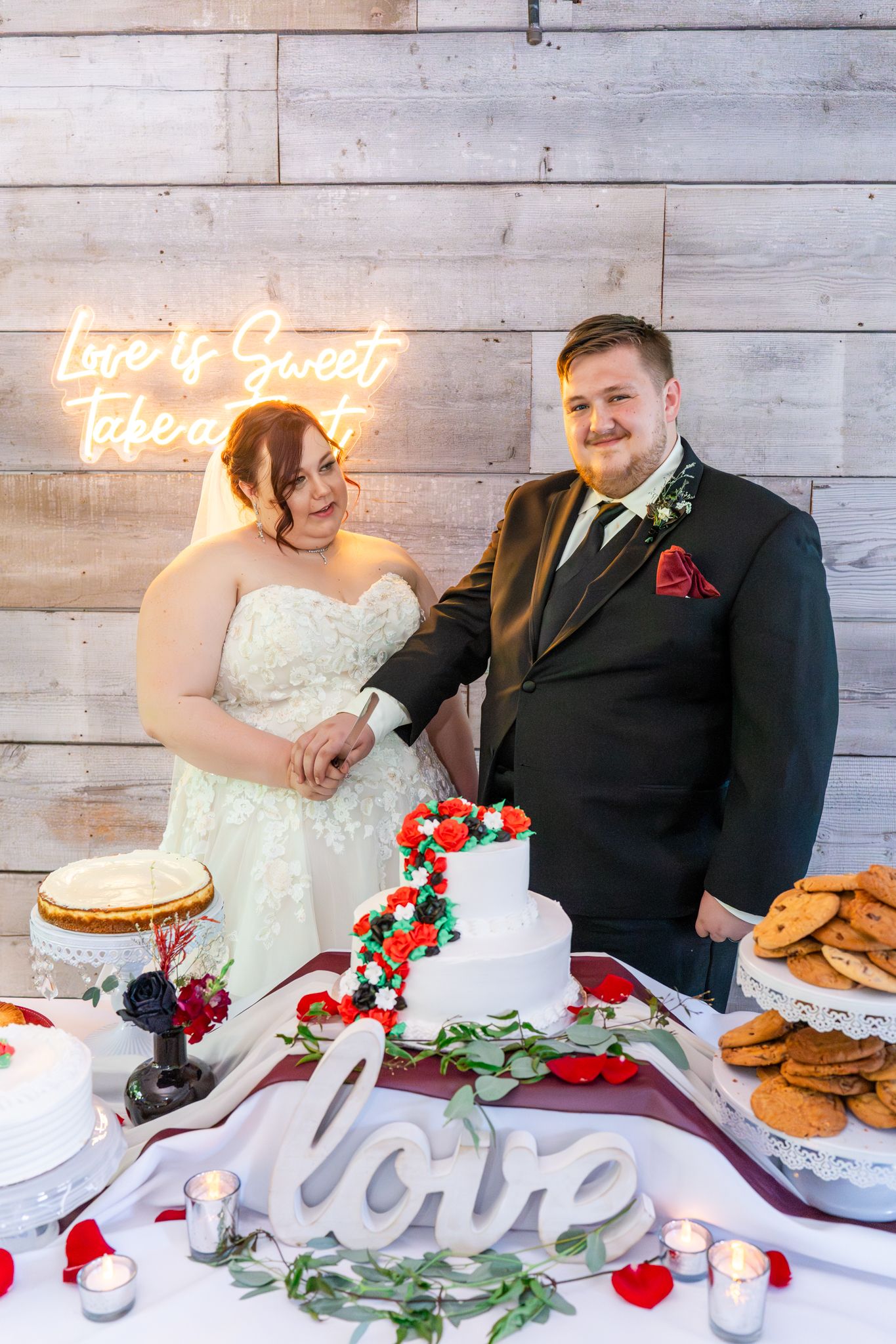 bride and groom cut the cake
