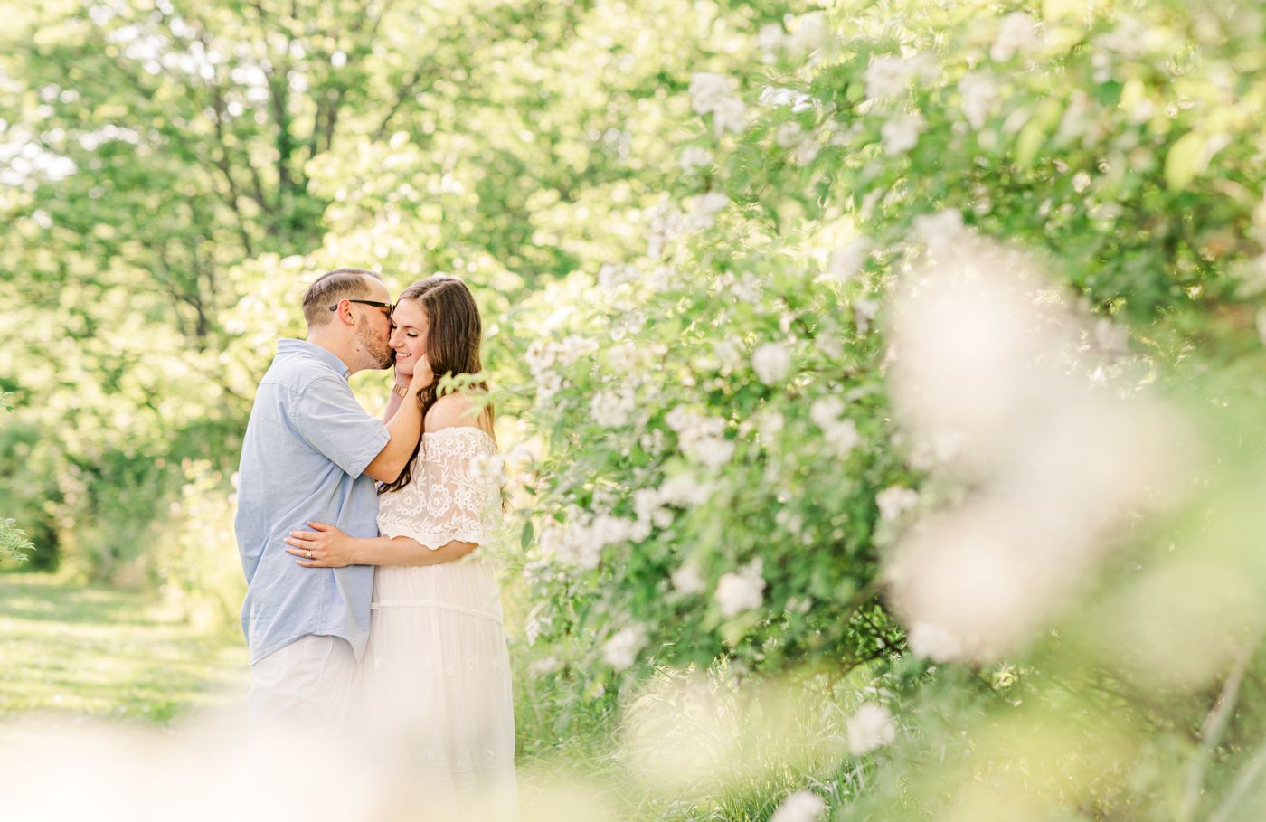 Man kissing woman on cheek during a couples session in New Paltz, NY with Danielle Lauren Photography