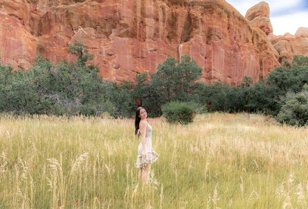 Senior girl portrait Red Rocks field Colorado