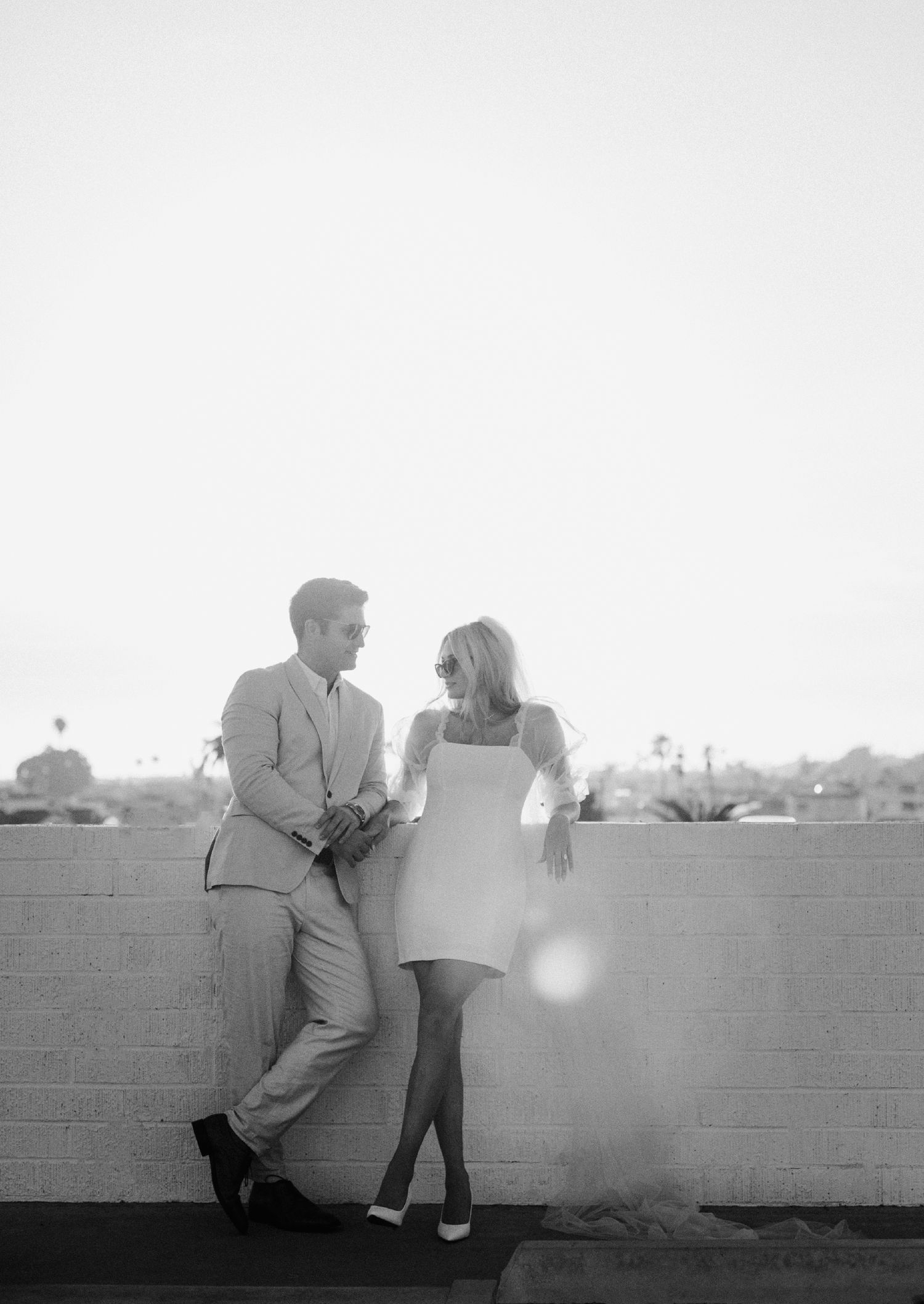 35mm film photo of fun bridal themed engagement shoot on roof of parking structure in Lido Marina, Newport beach
