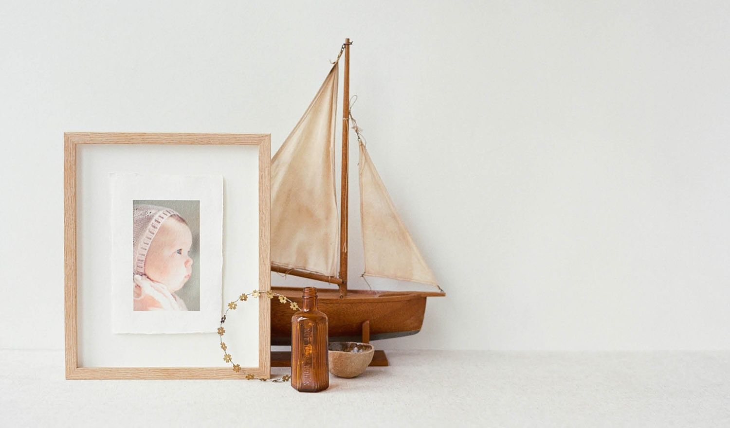 Framed photo of a child, accompanied by thoughtful decorations, creating a personalized and cozy atmosphere.