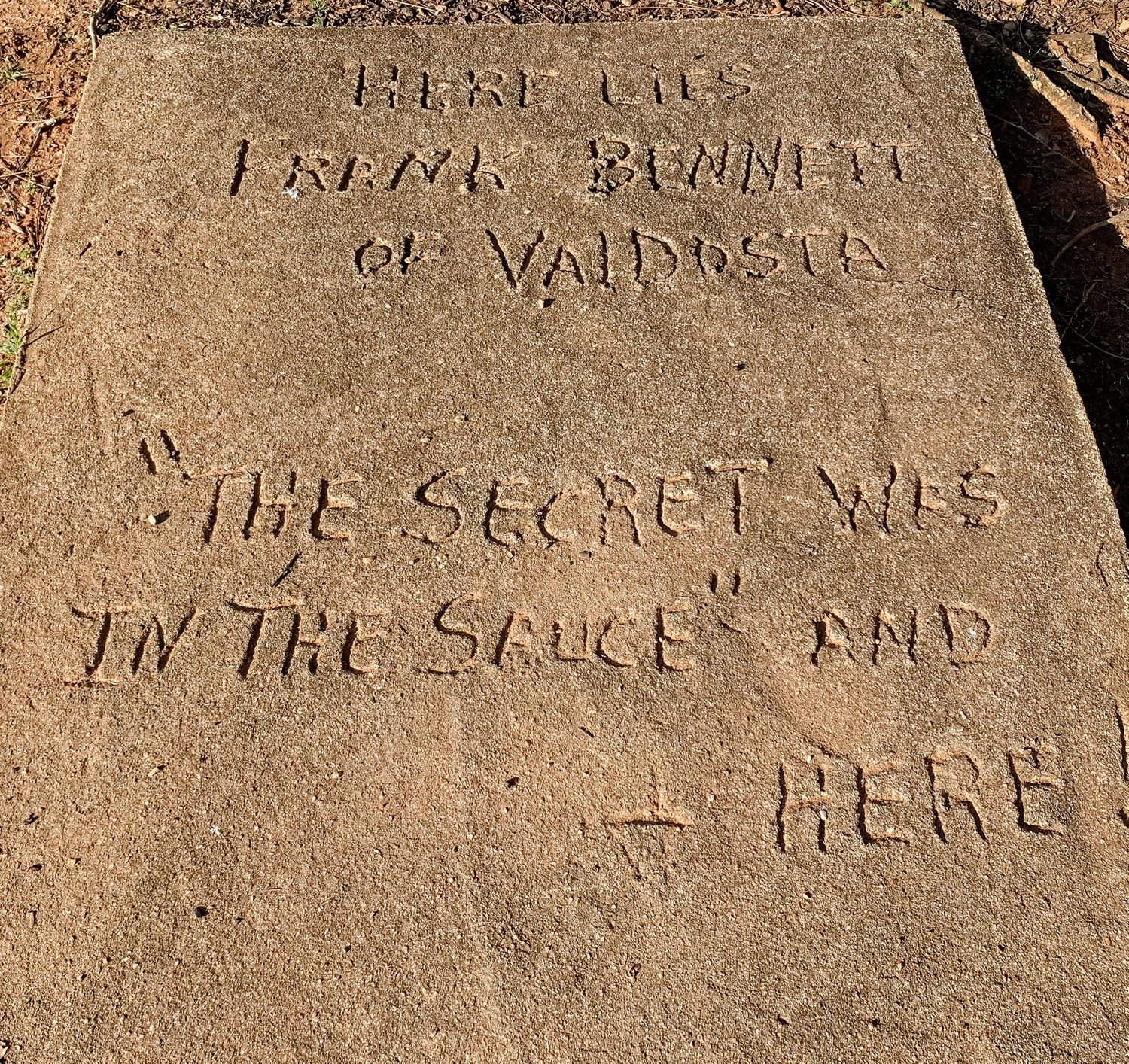Ancient carved stone inscriptions showing weathered text and markings.