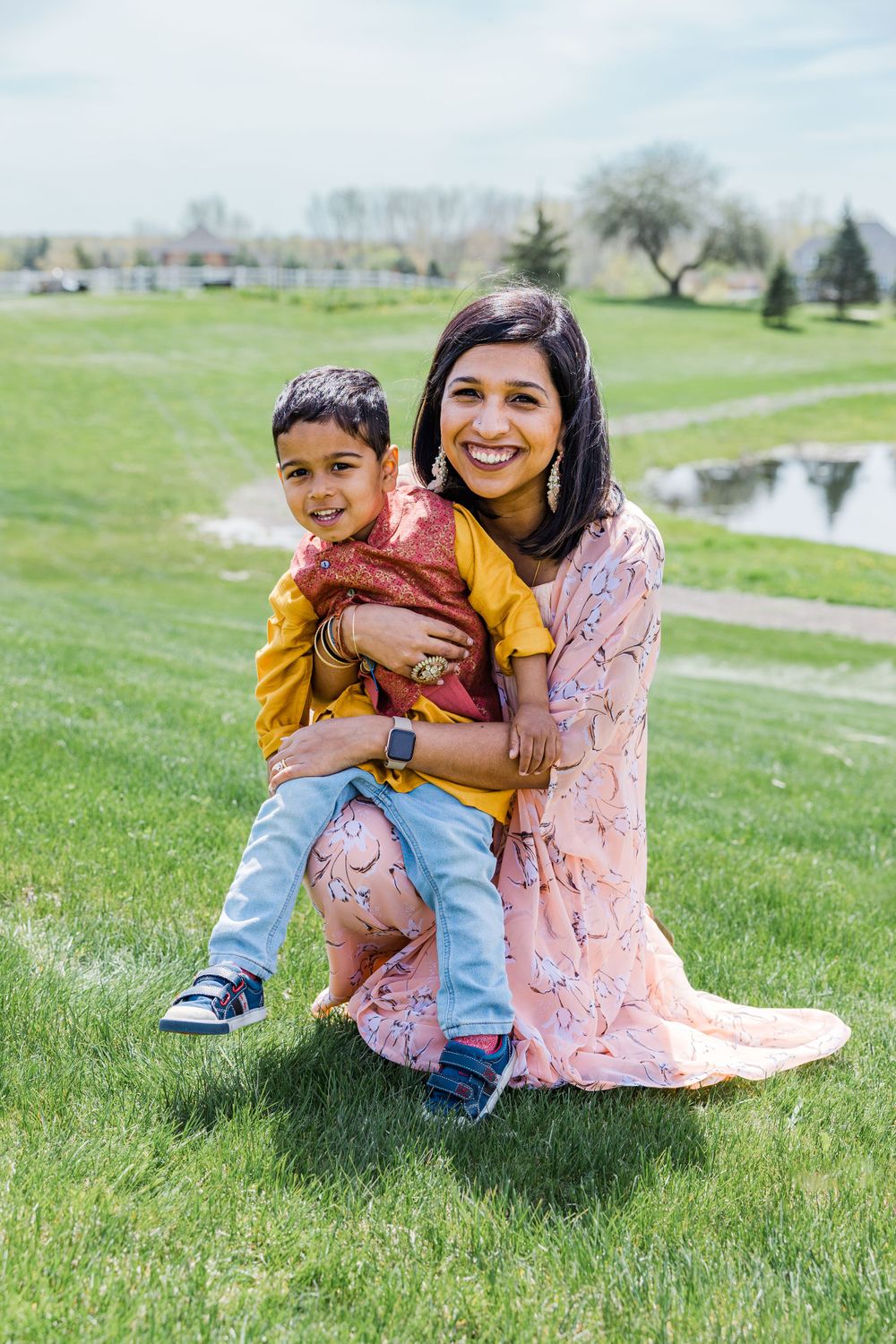 A heartwarming candid portrait of parent and child having fun in a park setting.