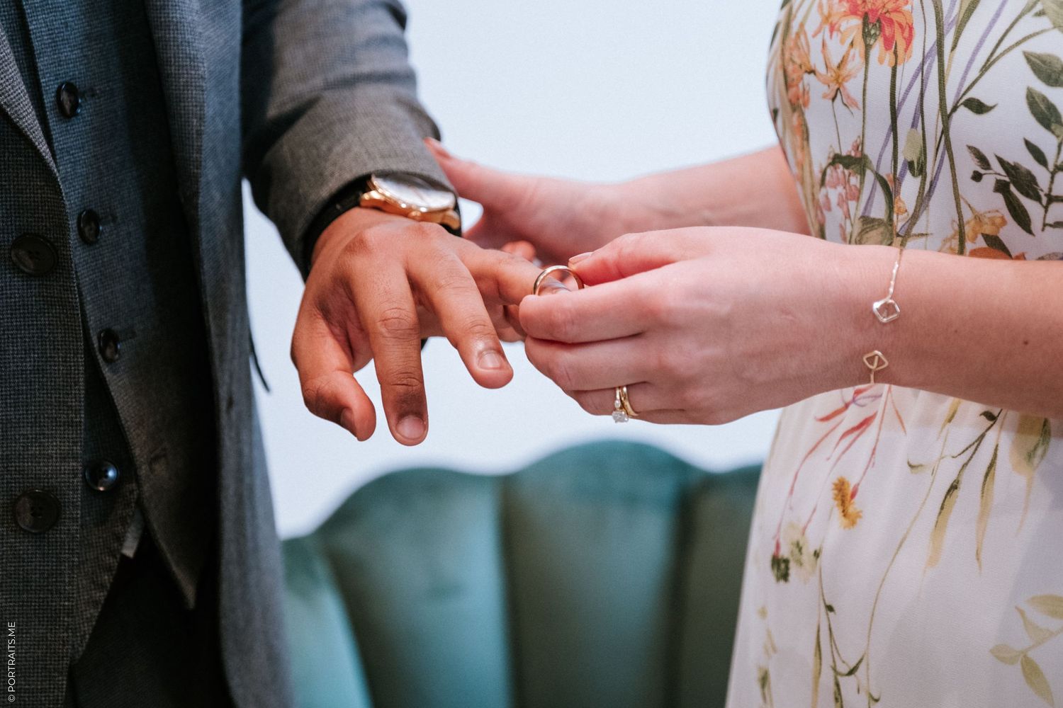 Bride places ring on groom's finger