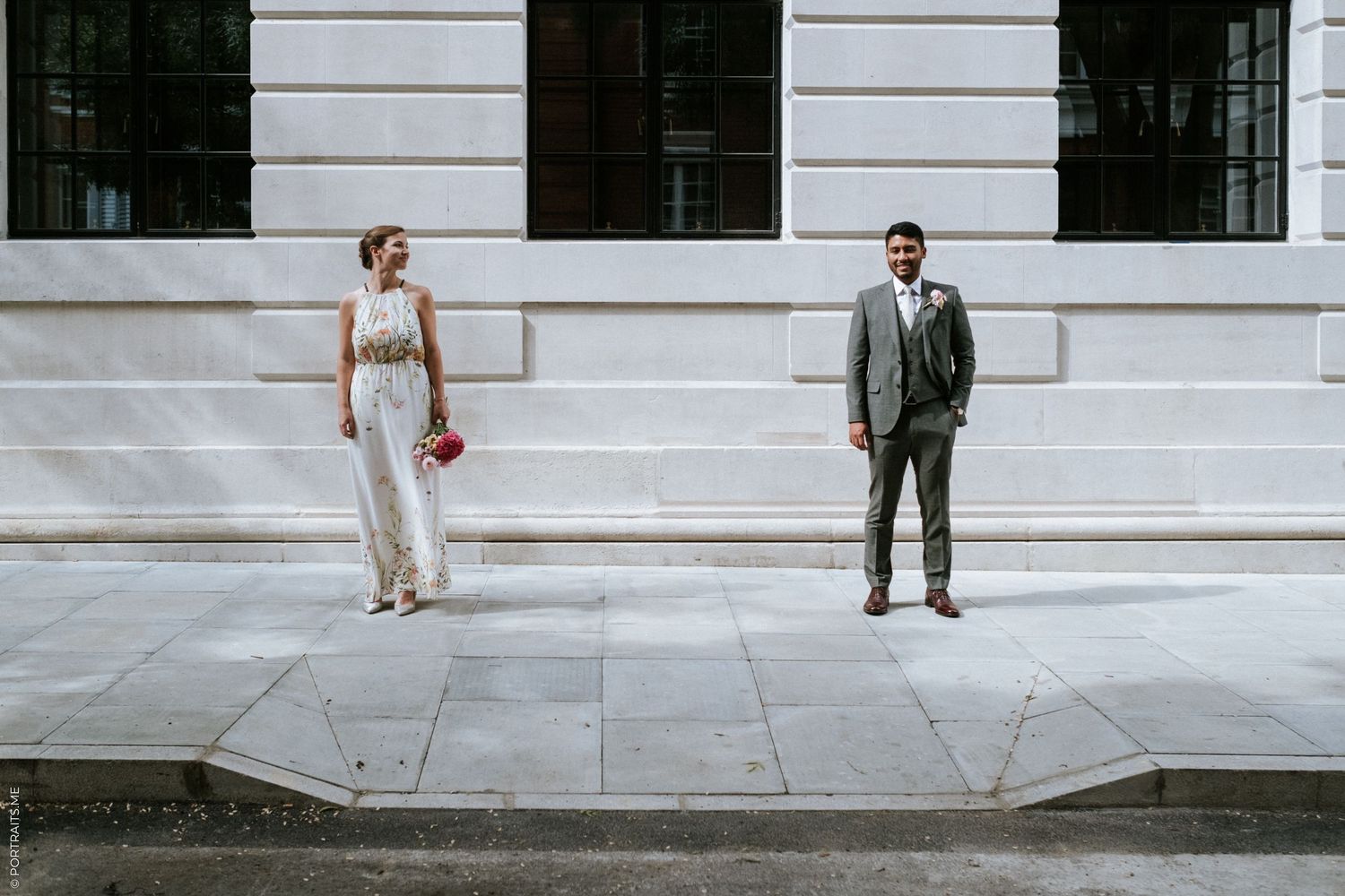 Newly weds outside Camden Town Hall on the side street