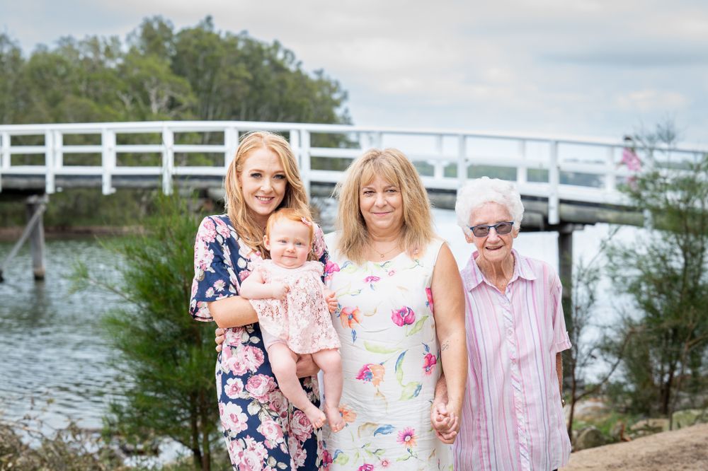 Four generations in one image posed by the bridge