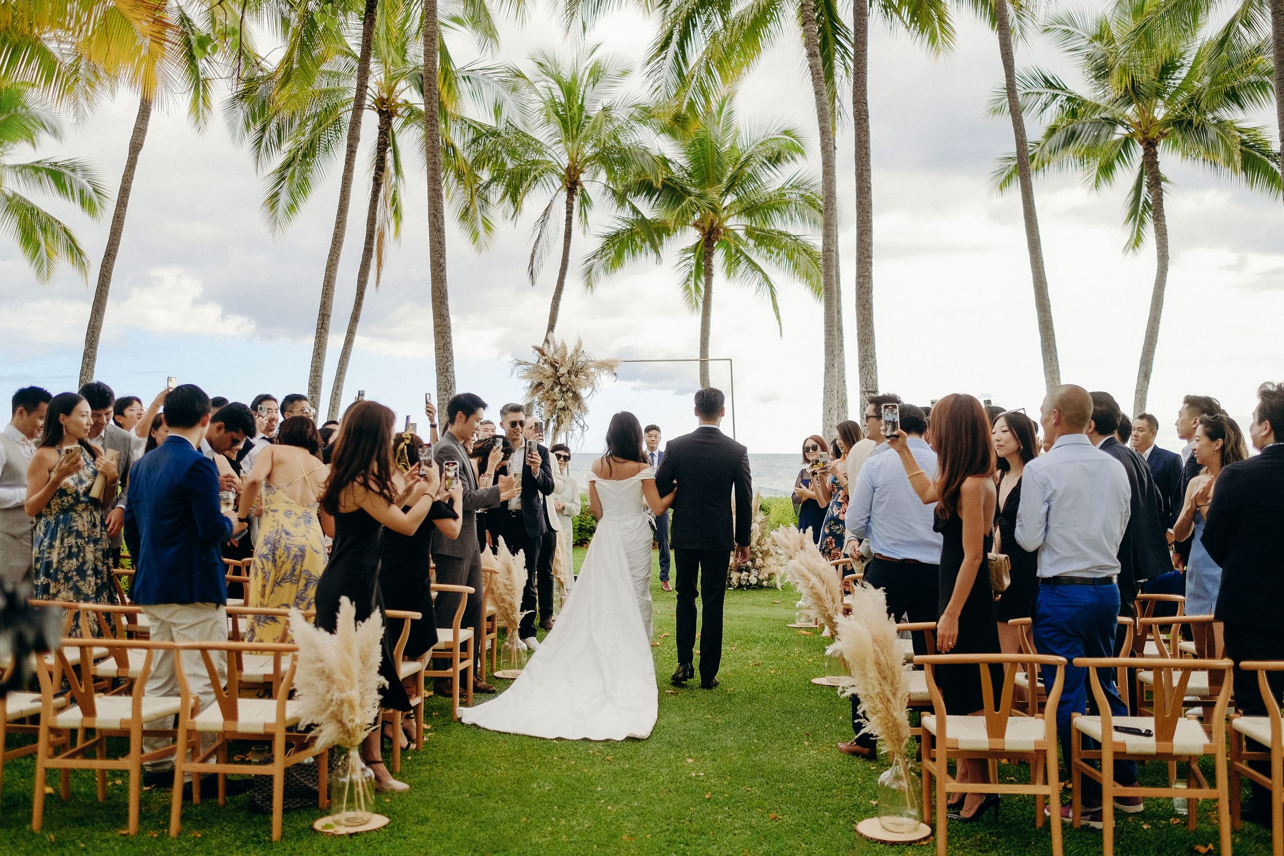 Wedding ceremony at Lanikuhonua Venue, Ko Olina, Oahu, captured by a wedding photographer during a beautiful moment.