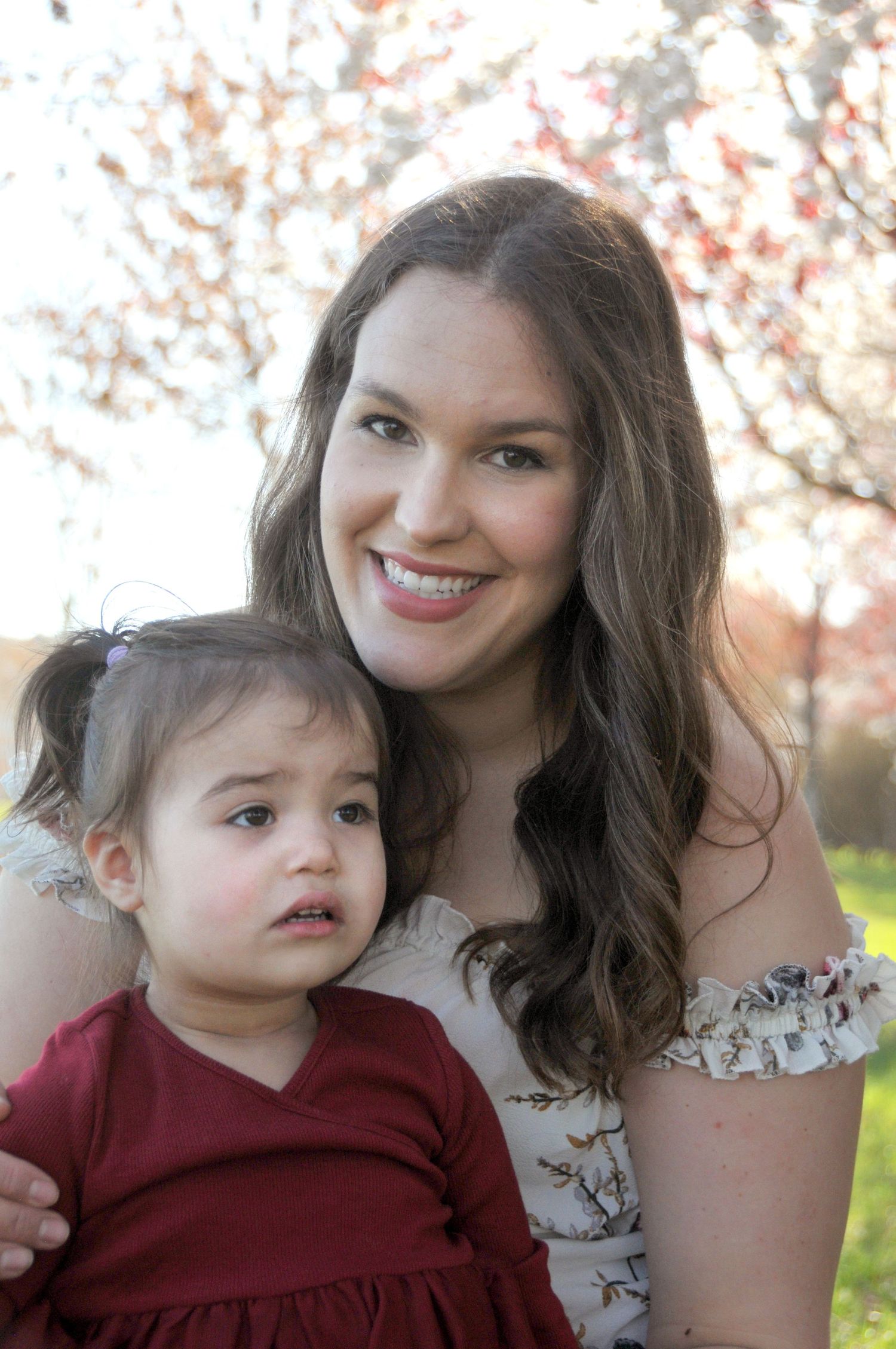 photo of mom and daughter and cherry blossoms