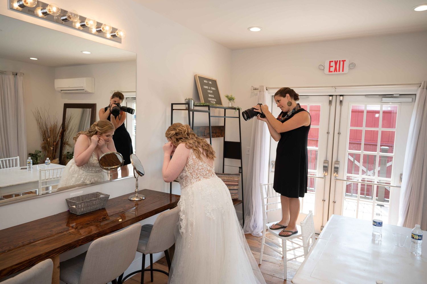 Behind-the-scenes of wedding preparation showing styling and photography in a bridal suite.
