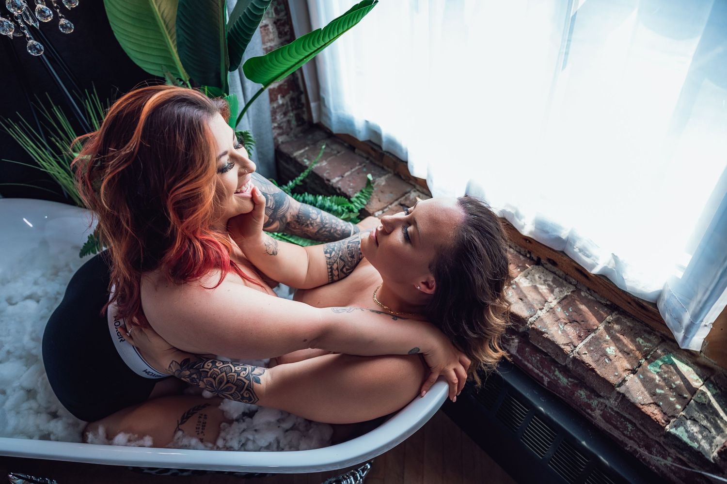 Joyful couples boudoir session encouraging body positivity and laughter-filled love - Boudies by Katie May Clicks