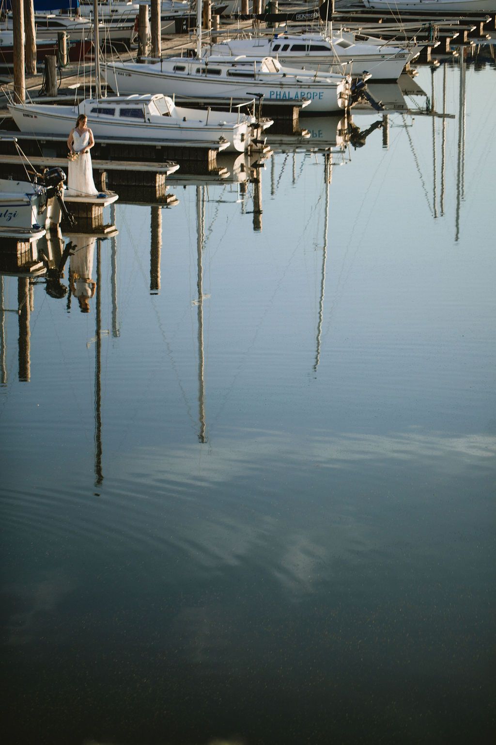Bride in a boat dock.