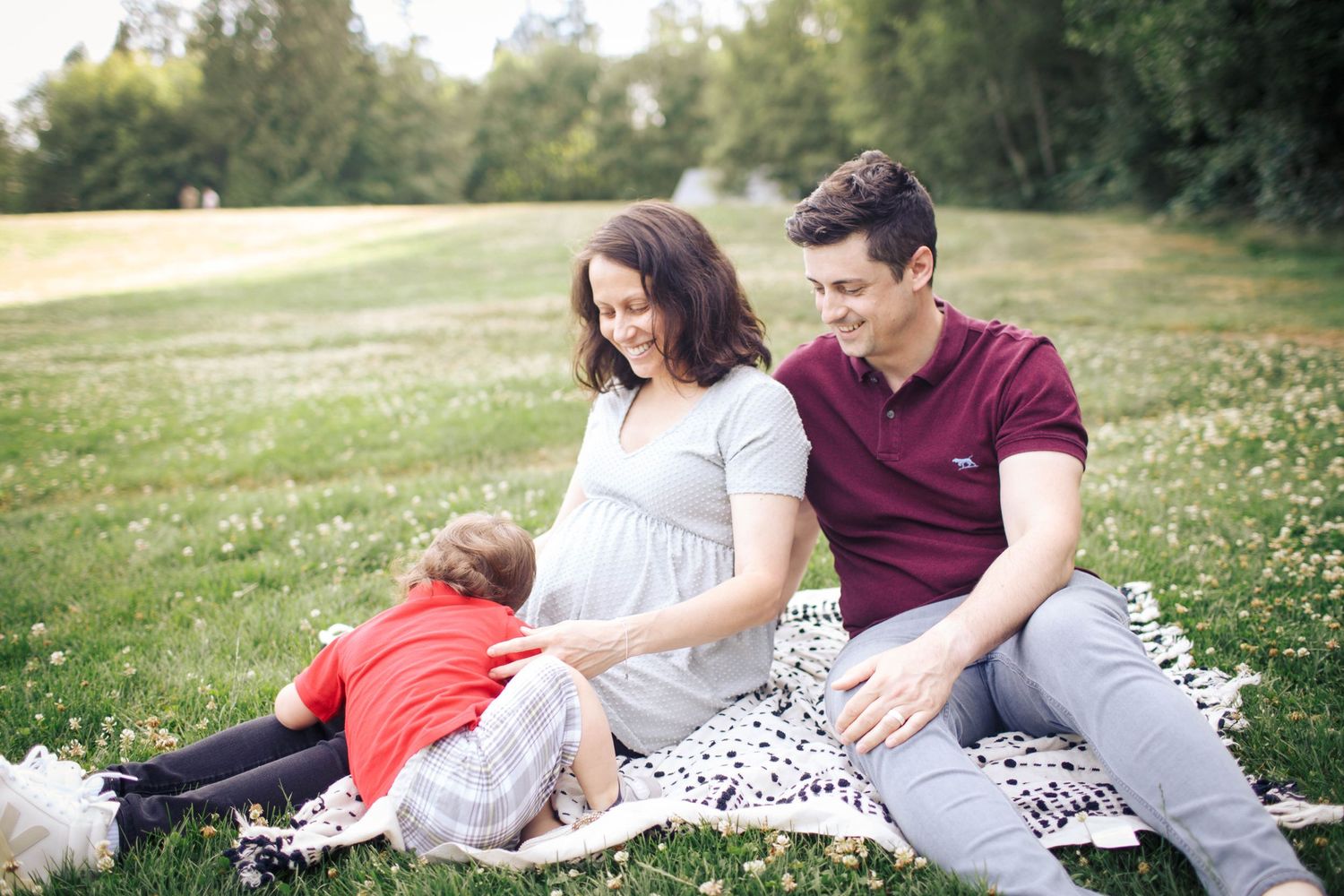Everett maternity photo session: A mother, father and toddler at their maternity photo session at Wills D. Tucker park