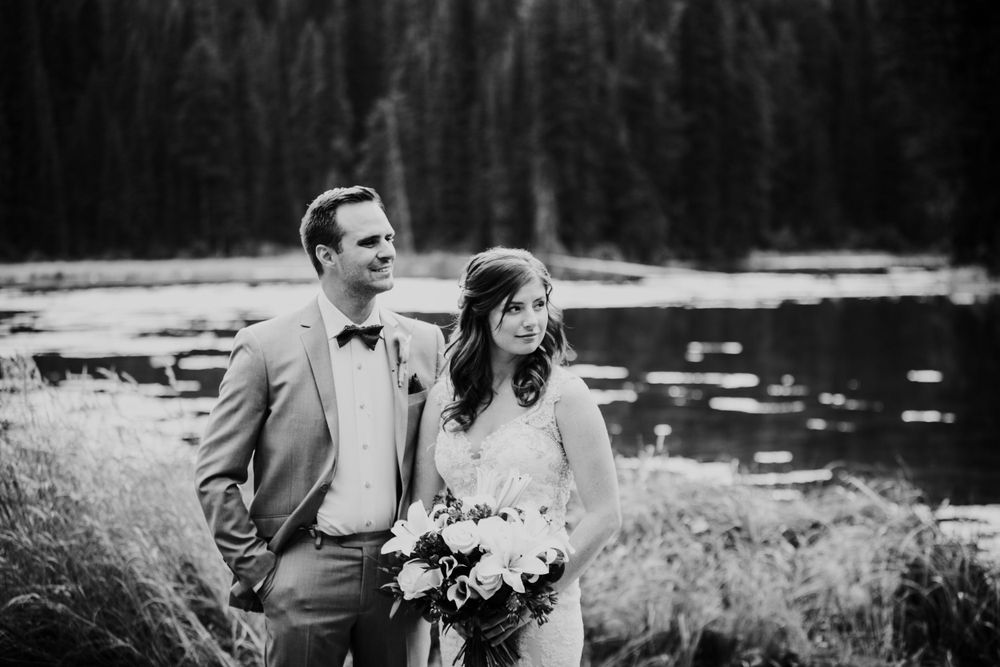 Black and white wedding portraits captured in scenic mountain setting.