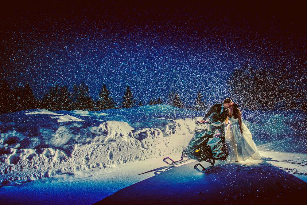Snow-covered winter landscape panorama with blue lighting creates a magical scene.