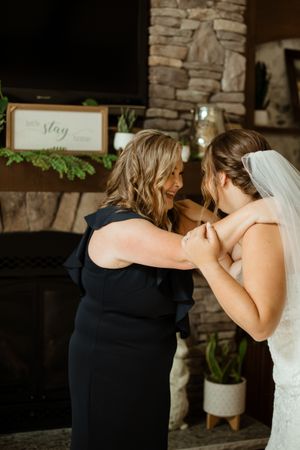 An emotional moment shared between two people during a wedding celebration.